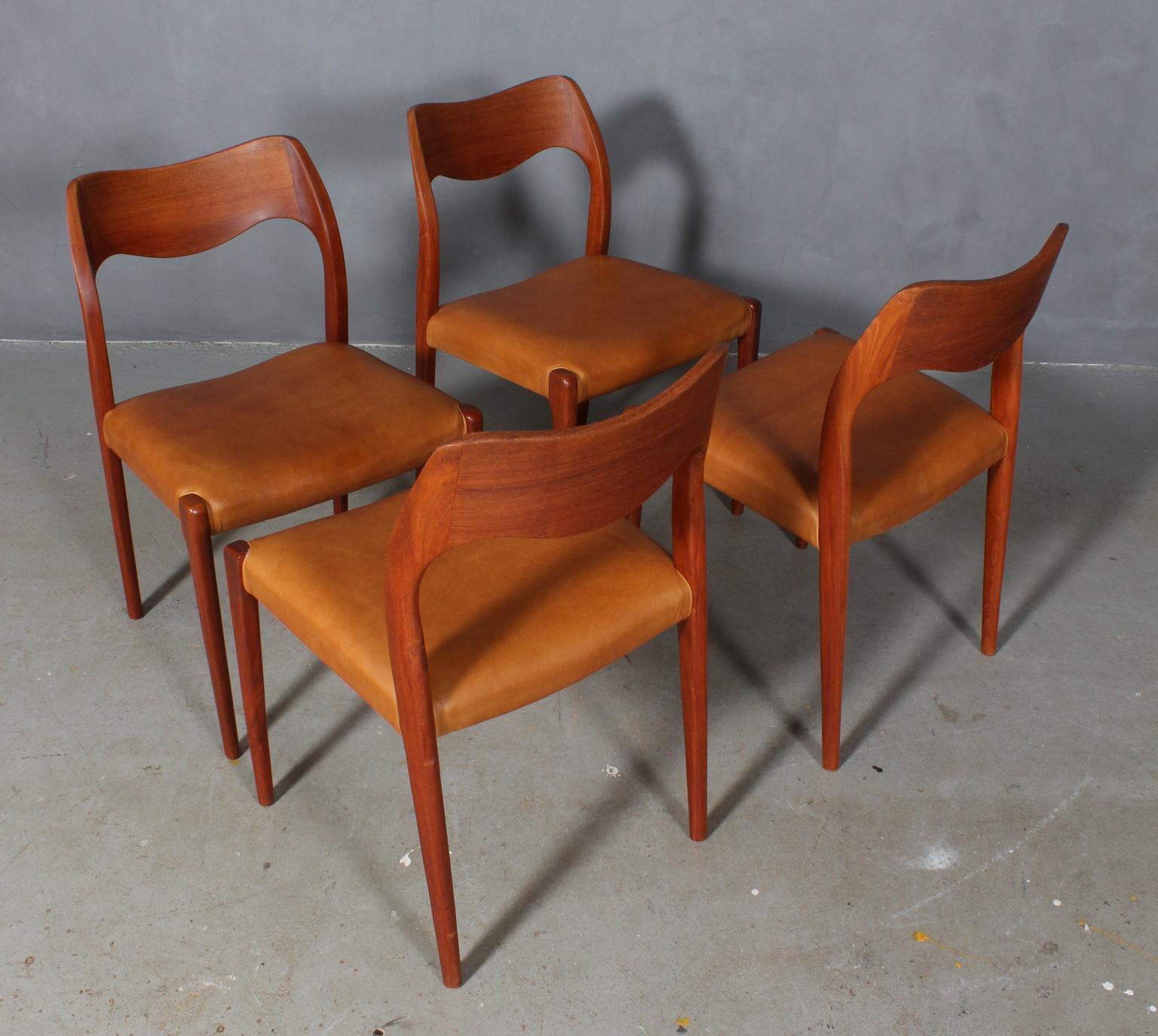 N. O. Møller set of four dining chairs in teak.

Seat new upholstered with vintage tan aniline leather.

Model 71, made by J. L. Møller, Denmark, 1960s.