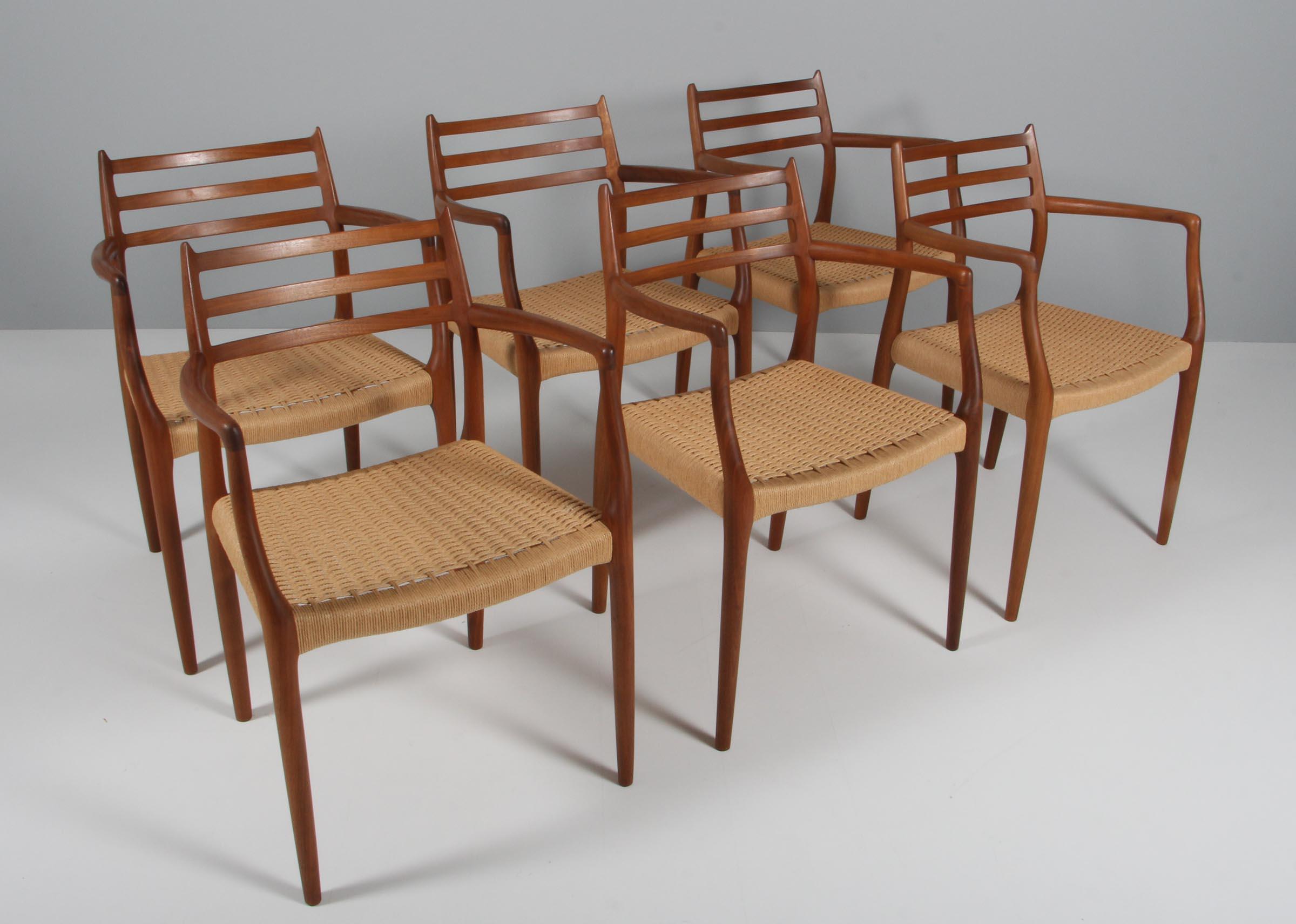 N. O. Møller set of six armchairs with frame of solid walnut.

Seat with papercord.

Model 62, made by J. L. Møller, Denmark.