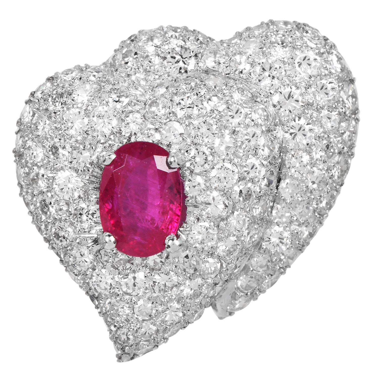 These stunning Heart-shaped diamond cluster ruby clip-on earrings are crafted in solid platinum. Showcasing a stylish design,  set with two genuine Natural, No-Heat red rubies weighing approx. 2.70 carats in total. These rubbies have No Treatments