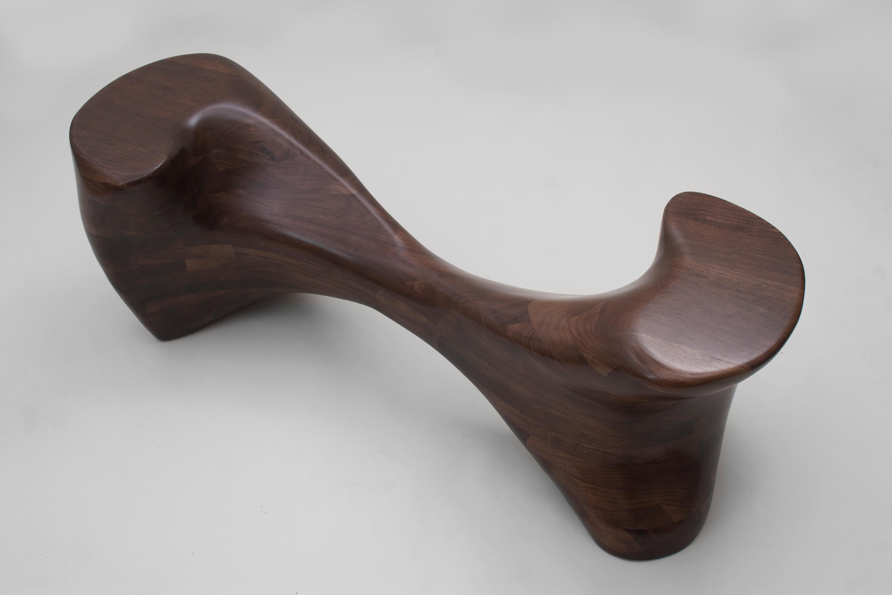 N2 TÊTE À TÊTE by Aaron Scott
Dimensions: D 43.5 x W 124.5 x H 43.5 cm
Materials: Walnut. 


Brooklyn-based designer Aaron Scott was raised in the mountains and forests of Southwest Oregon. He studied philosophy at the University of