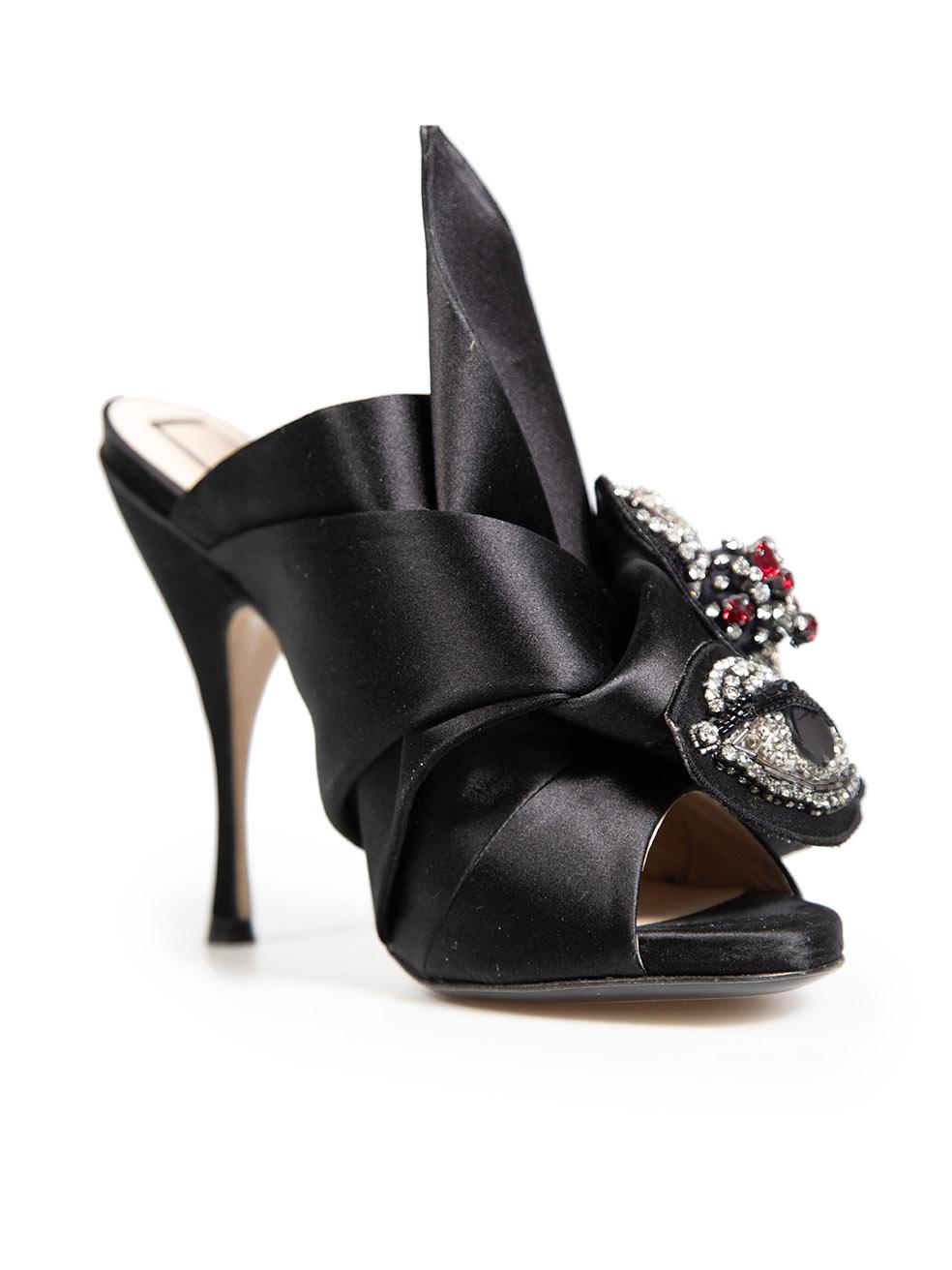 CONDITION is Very good. Minimal wear to mules is evident. Loose threads and light glue residue marks on the front and left side of right shoe on this used N°21 designer resale item.
 Details
 Black
 Cloth textile
 Mules
 Open toe
 Embellished