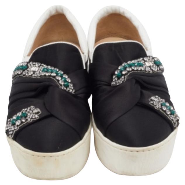 The addition of beautiful crystal embellishments makes this N21 sneakers a stunning pair to own. With a perfect combination of function and fashion, they are created from leather and satin. The rubber soles of these shoes aim to provide you with