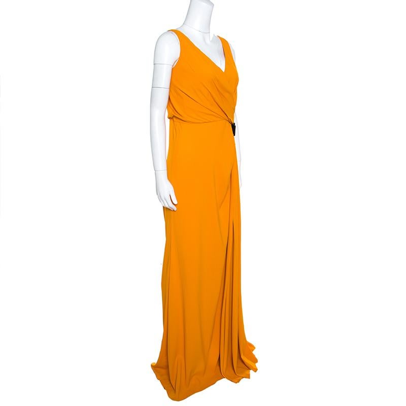 This vibrant mustard yellow maxi dress from N21 is all you need on days you want to create your own sunshine! It is made of a blend of fabrics and features an asymmetrical pleated silhouette. It flaunts a V-neckline and lace trim detailed shoulder