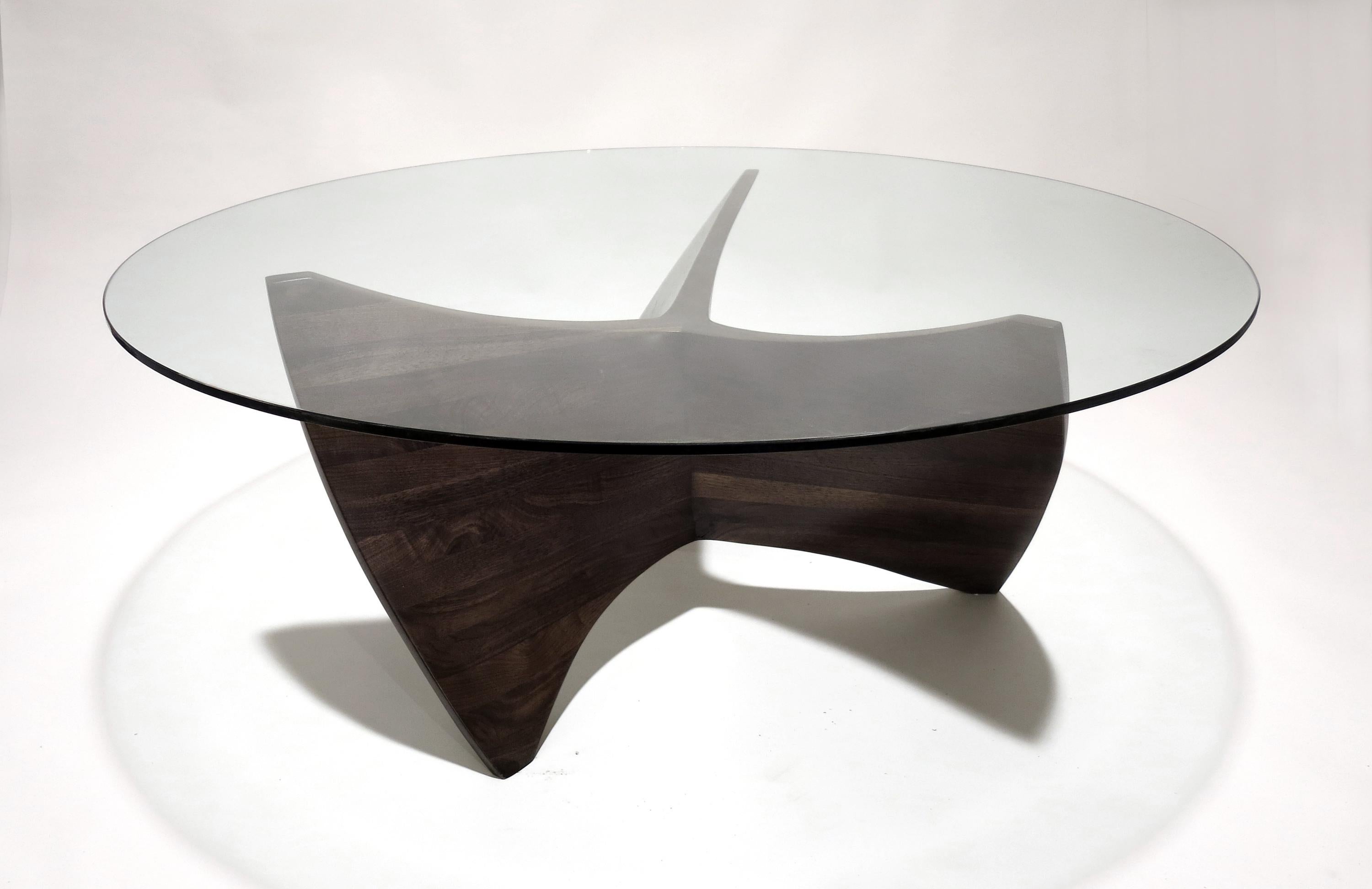 N3 Coffee Table by Aaron Scott
Dimensions: D 122 x W 122 x H 41 cm
Materials: Walnut, Glass.
Also available in other woods: bleached cherry, bleached walnut. 


Brooklyn-based designer Aaron Scott was raised in the mountains and forests of