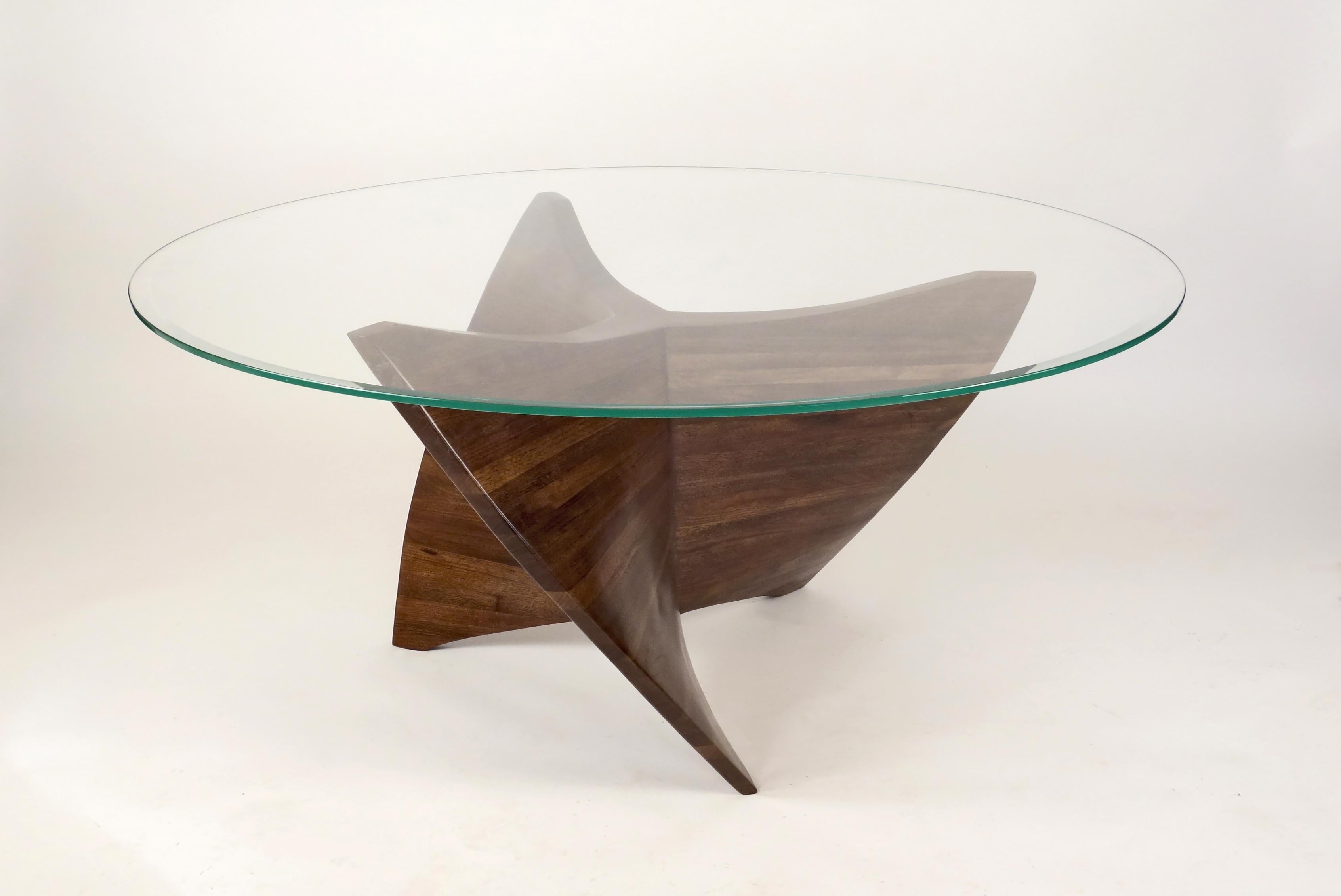 N3 Coffee Table by Aaron Scott
Dimensions: D 122 x W 122 x H 41 cm
Materials: Walnut, Glass.
Also available in other woods: bleached cherry, bleached walnut. 


Brooklyn-based designer Aaron Scott was raised in the mountains and forests of