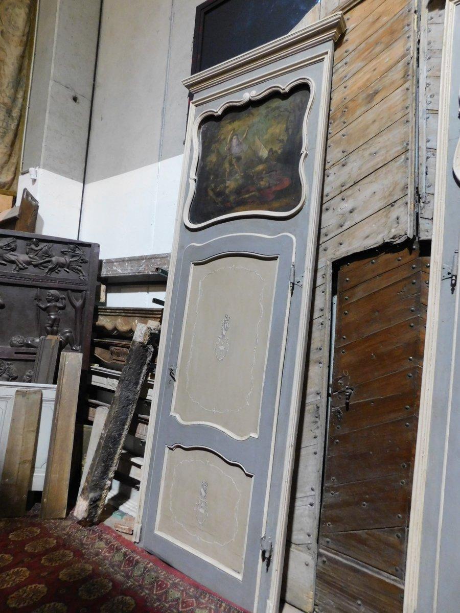 Set of n. 6 antique lacquered doors, single-winged, with overdoor painted on canvas (to be revised if a restoration is needed to taste), lacquered with beige and blue tones, with central paintings, also decorated on the back, stand out imposing and