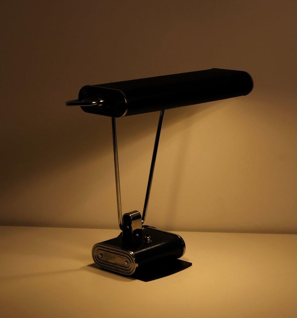 N71 Desk Lamp by Eileen Gray for Jumo, 1930's. 2x 40 watts max E-12 North American bulb recommended or higher if LED/CFL.

Refurbished. New E-12 candelabra bulb sockets, cloth cord and North American polarized plug. Minor tarnish, dings, scuffs,