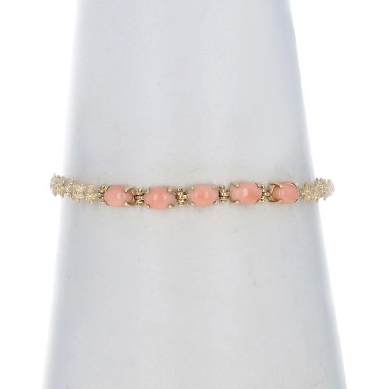 Brand: Na Hoku

Metal Content: 14k Yellow Gold

Stone Information

Natural Coral
Cut: Oval Cabochon

Style: Link
Fastening Type: Lobster Claw Clasp
Theme: Plumeria Flowers

Measurements

Side Width: 7/32