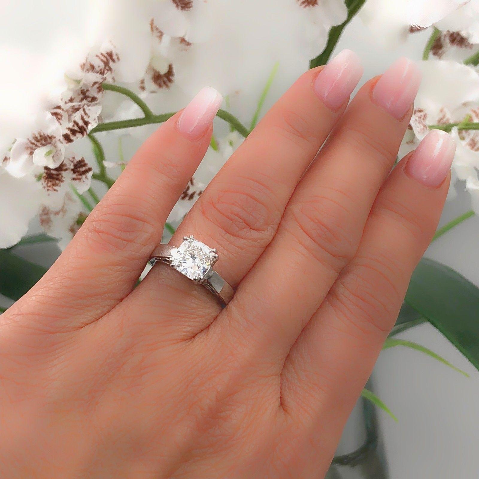 Na Hoku 
Cushion Cut Diamond Solitaire Engagement Ring in 18kt White Gold.  
Cushion Diamond is 1.97 CTS F color, VVS1 clarity.... diamond is inscribed NA HOKU IGI GT12278112.  
Ring is Hallmarked NA HOKU 18K 1.97.  
Size 5 - sizable.  
Includes IGI