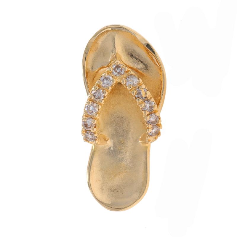 Retail Price: $799

Brand: Na Hoku

Metal Content: 14k Yellow Gold

Stone Information

Natural Diamonds
Carat(s): .22ctw
Cut: Round Brilliant
Color: H - I
Clarity: SI1 - SI2

Total Carats: .22ctw

Theme: Flip-Flop, Summer Sandal, Beach