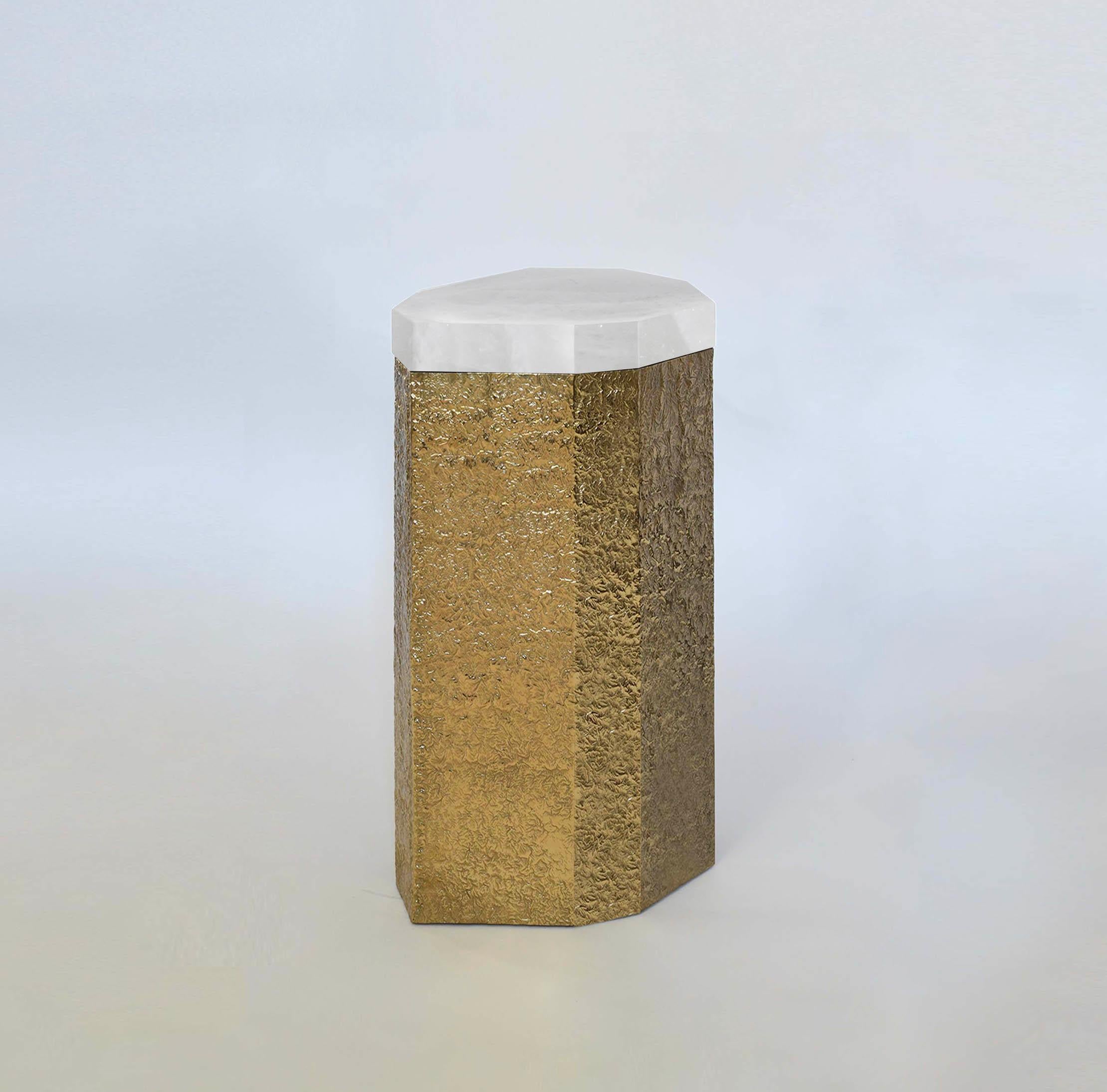 Nine angles rock crystal side table with hammered brass base. Created by Phoenix Gallery, NYC.
Custom size, quantity, and finish upon request.