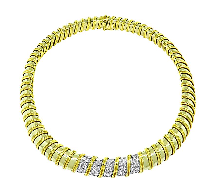 This is a fabulous 18k yellow gold choker necklace by Nabucco. The necklace is set with sparkling round cut diamonds that weigh approximately 1.80ct. The color of these diamonds is H with VS clarity. The necklace measures 15mm in width and 15 1/4