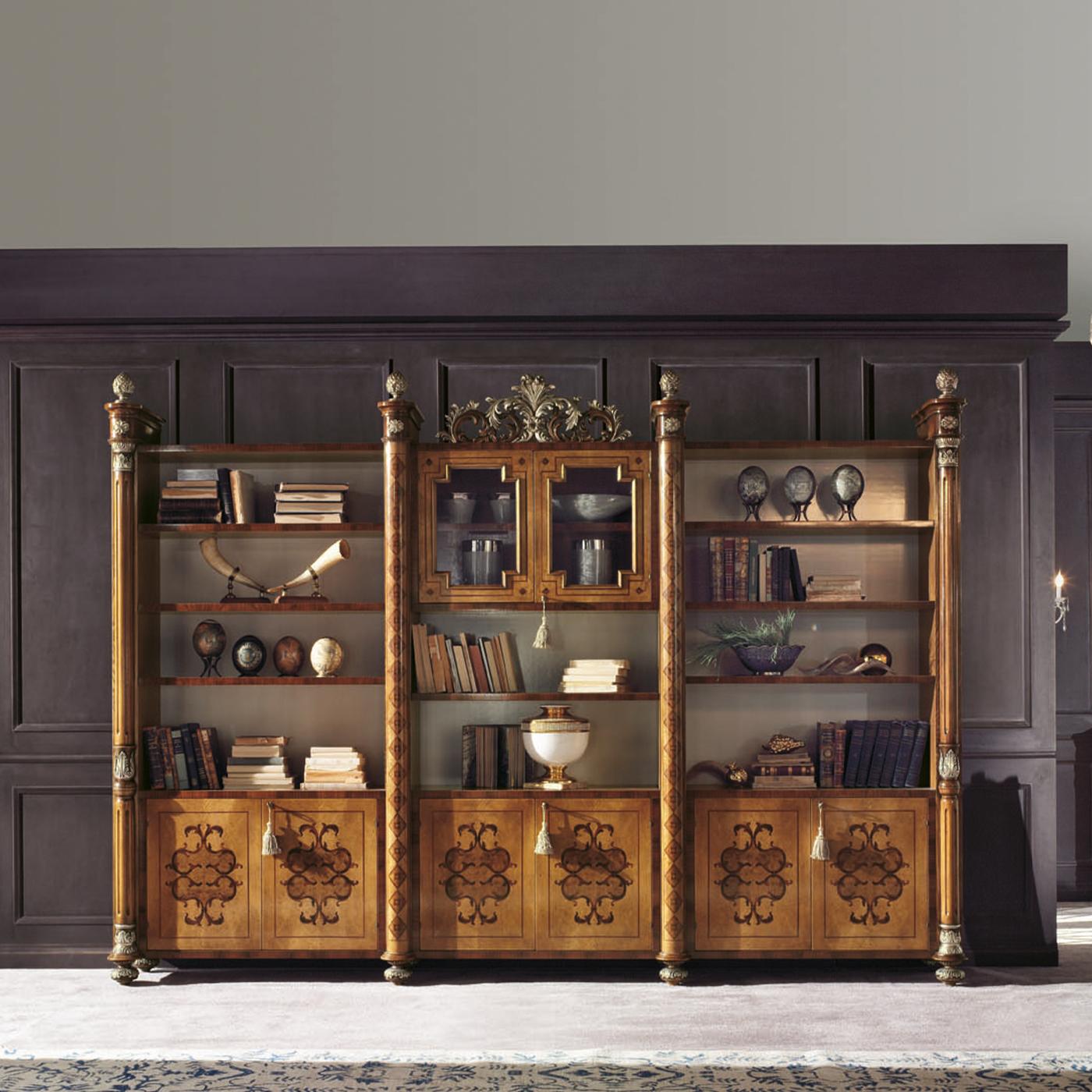 Arranged in three units respectively featuring four shelves and a closed compartment, this majestic bookcase flaunts a prized and bold aesthetic. Feathered ash, walnut briar, and rosewood are used to craft its refined inlays completed by the carved