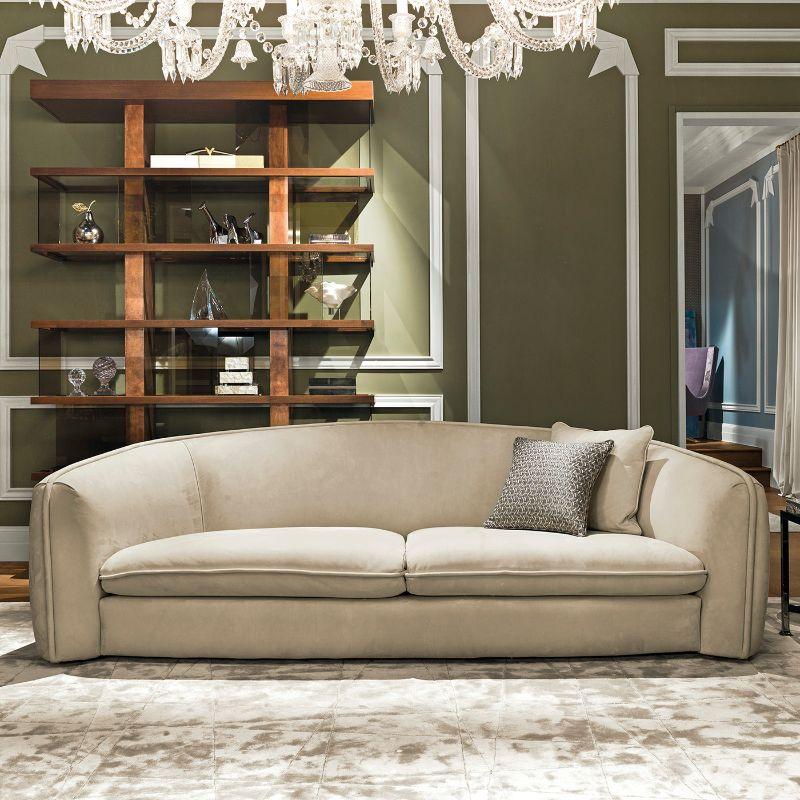 Timeless elegance and sophistication characterize this splendid sofa, marked by clean and simple lines of welcoming charm. Boasting a three-seat shape, it is entirely upholstered with beige nubuck leather. It includes two cushions.