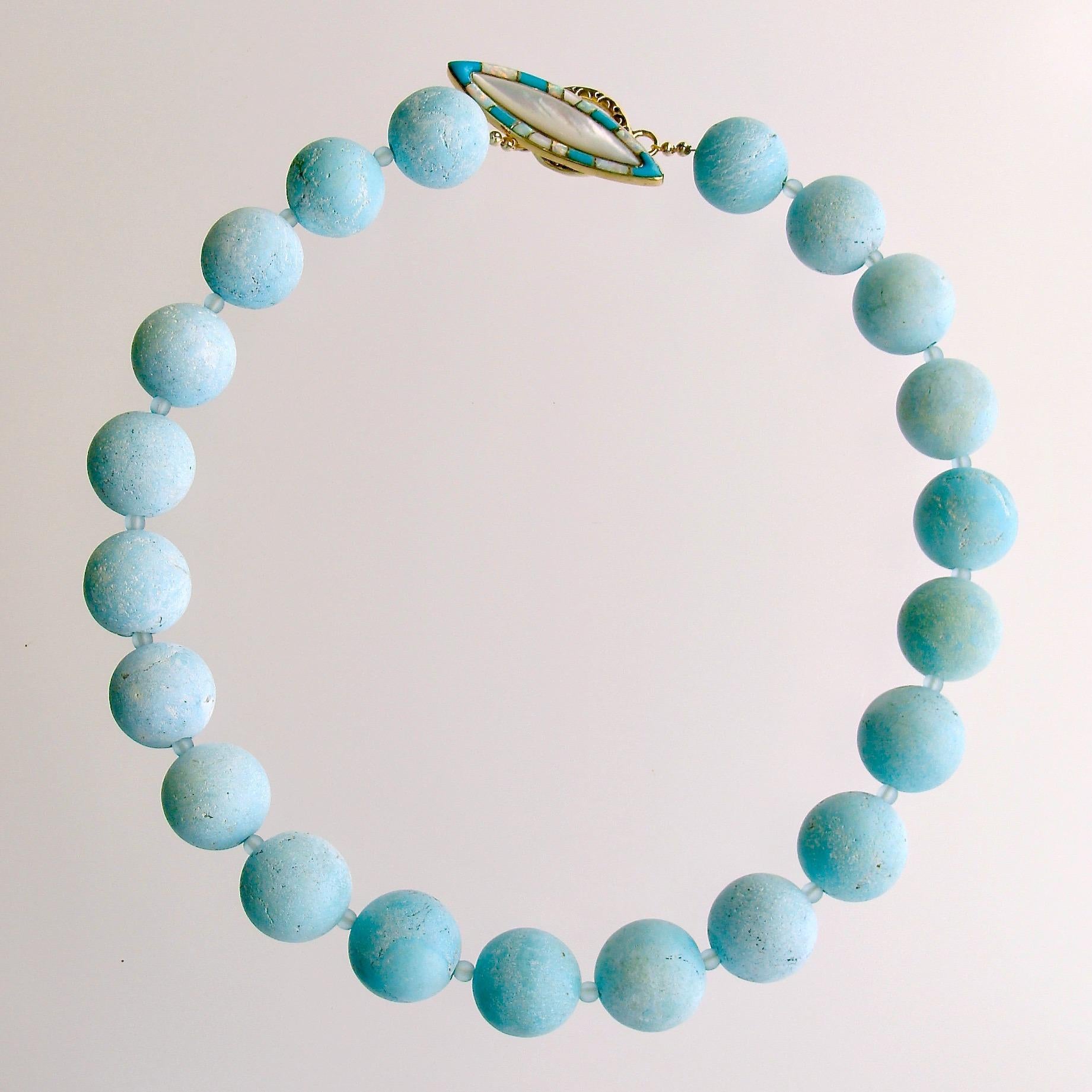 Luxe, highly-coveted and collectable 20mm matte Naco Turquoise beads, with their suede-like aqua finish, are further enhanced with a most unique marquise-shaped inlaid toggle clasp of Mother-of-pearl and opal.  Turquoise stones of this size are not