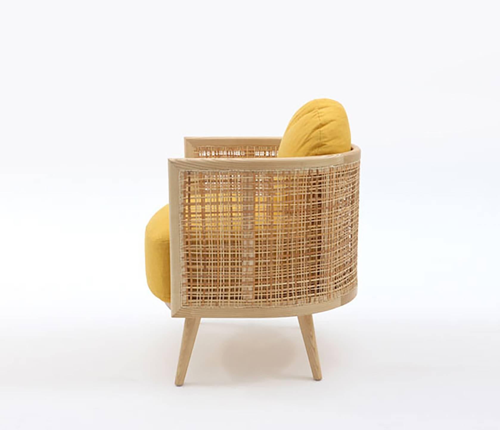 Nada Debs Summerland armchair, yellow fabric, natural wood. Mid-century design in ashwood is crafted into the piece, featuring woven straw. 

Condition: Brand New
Production Lead Time: Available now for pick up or shipping.
Color: Light brown /