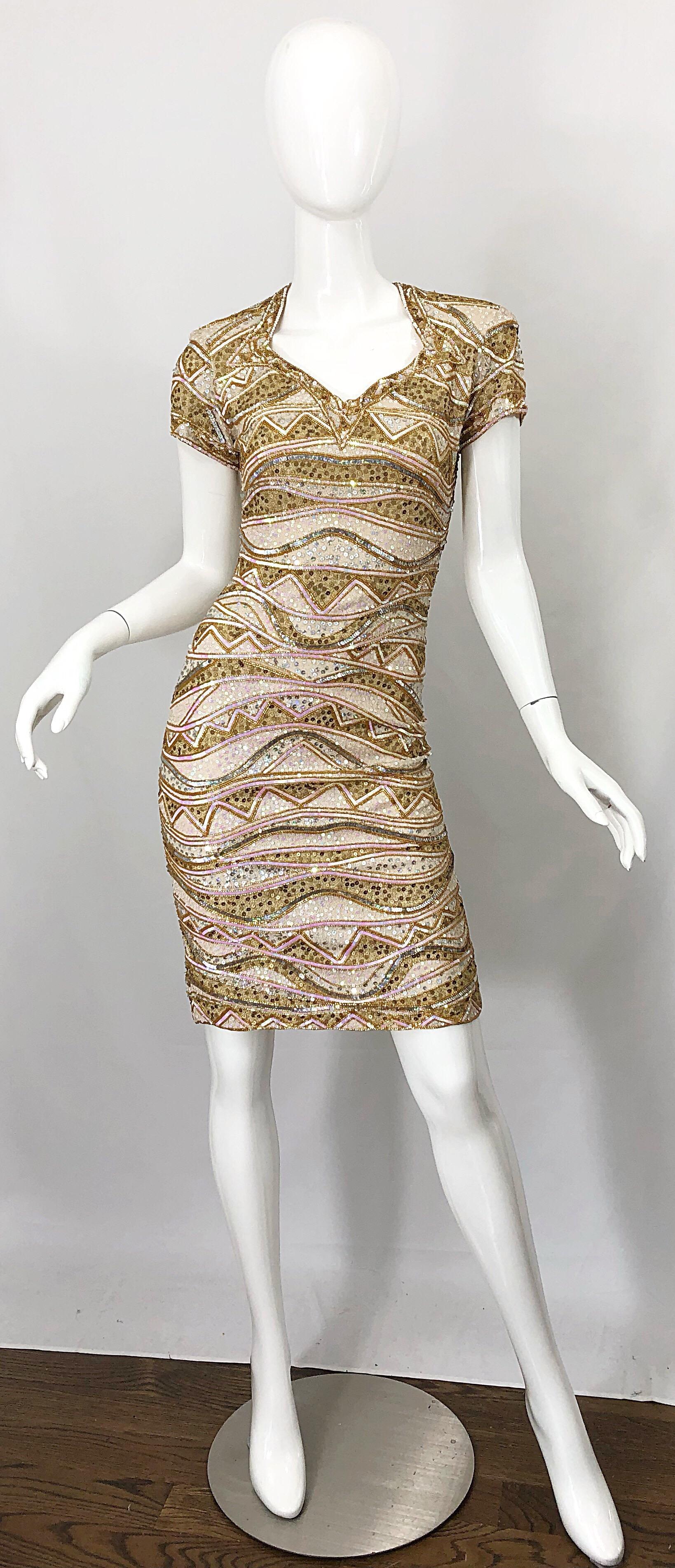 Beautiful vintage (with original tags still attached) NAEEM KHAN beaded and sequined silk bodycon dress! Features thousands of hand-sewn sequins and beads throughout the entire dress. Hidden zipper up the back with hook-and-eye closure. Shoulder