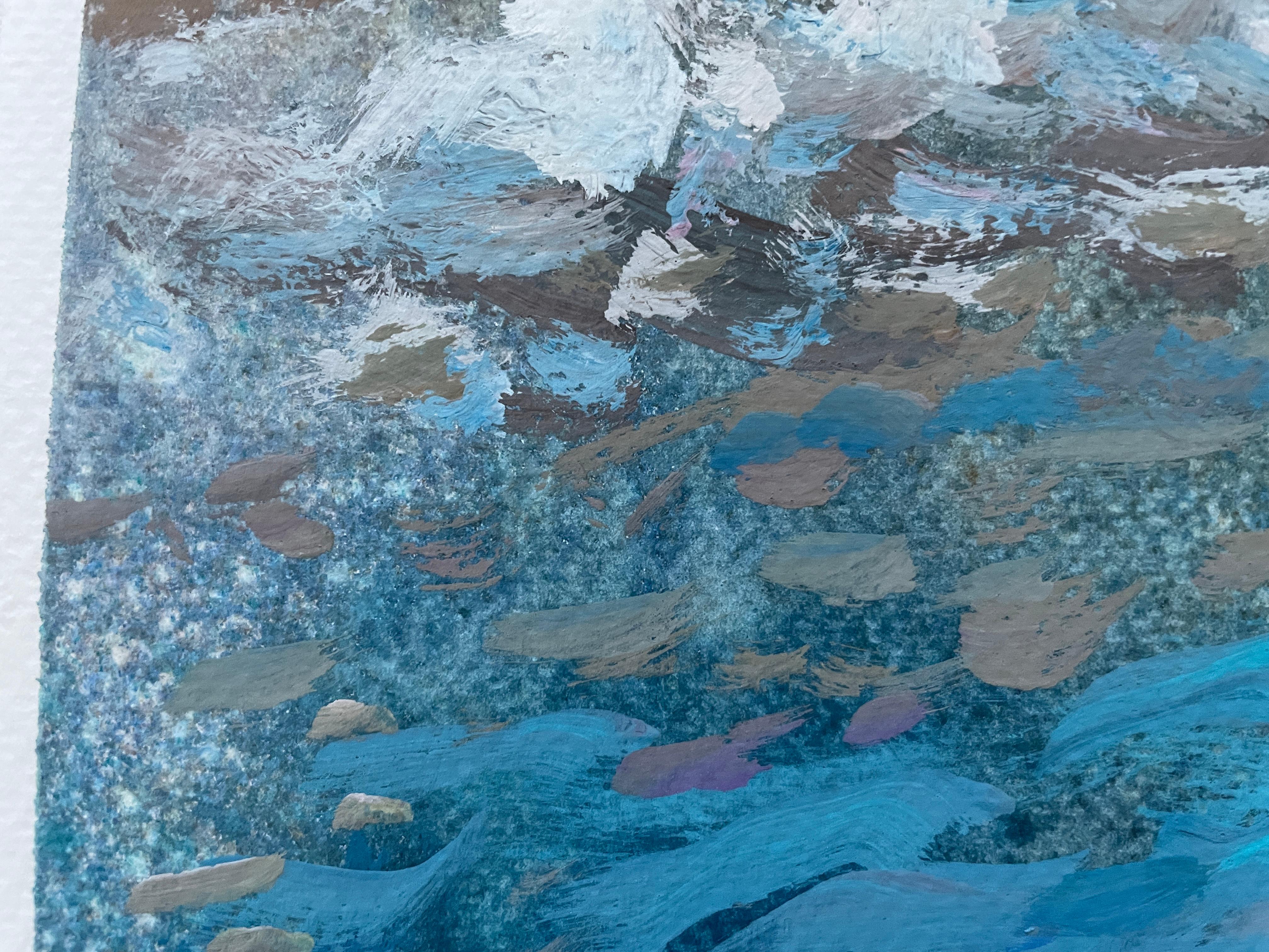 This artwork captures a tranquil seaside moment with two figures sitting on a sunlit, textured rock ledge. The artist expertly contrasts the deep, swirling blues of the ocean with the rough, earthy tones of the rock. The water's movement is depicted