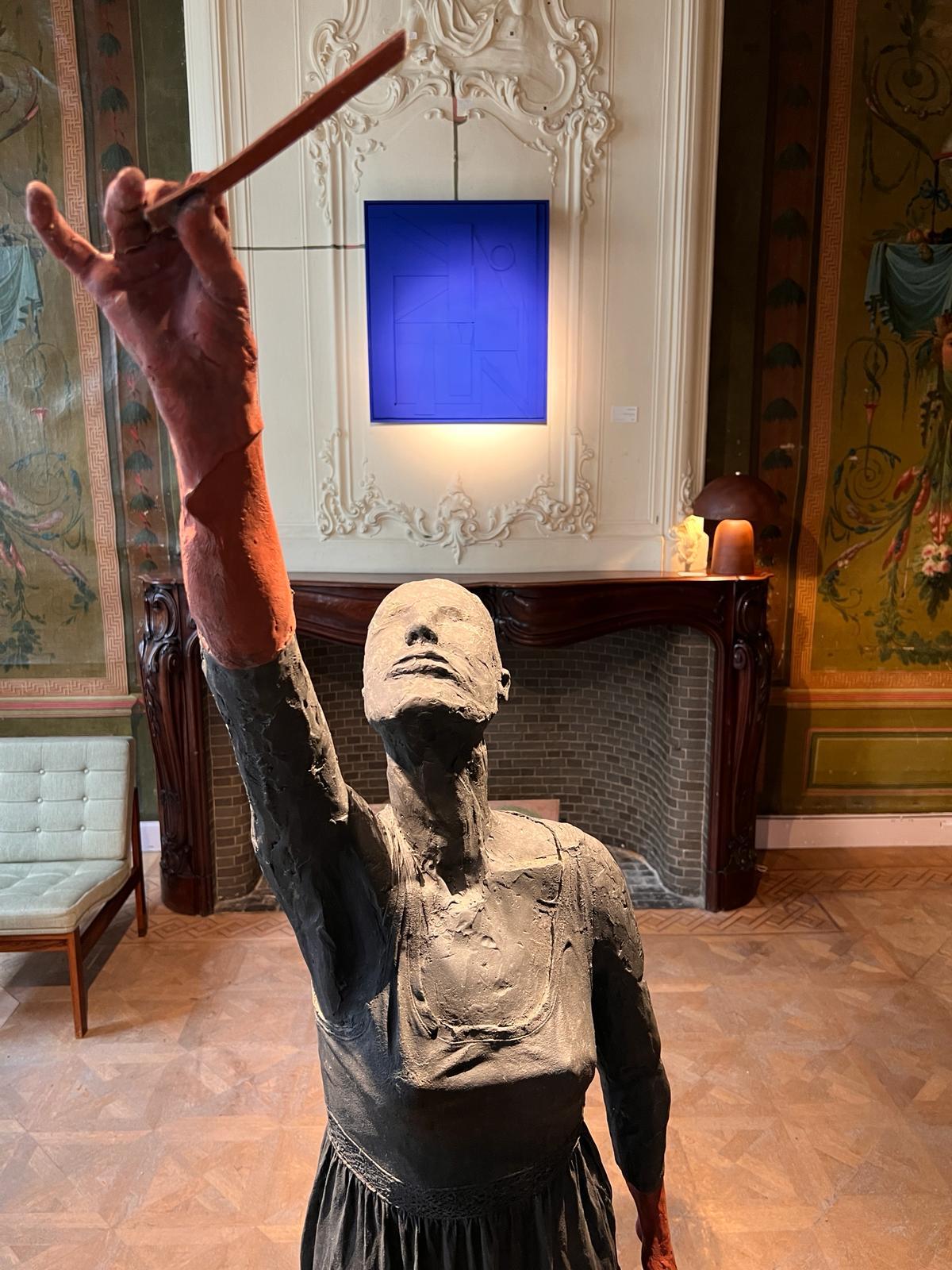 Bronze life-size statue of a woman standing, called 'Red Right Hand' - Sculpture by Nadine De Meester