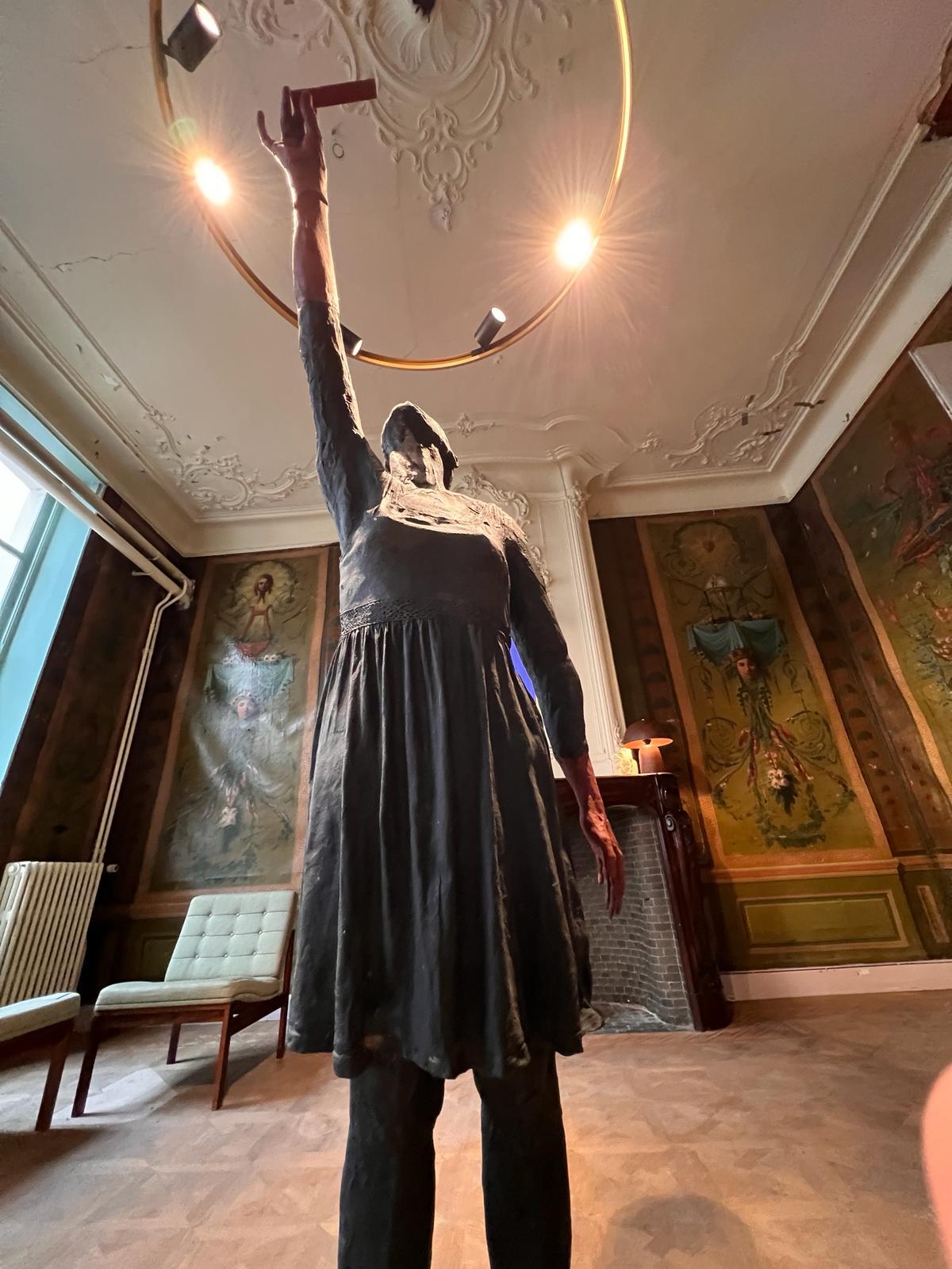 Bronze life-size statue of a woman standing, called 'Red Right Hand' - Modern Sculpture by Nadine De Meester