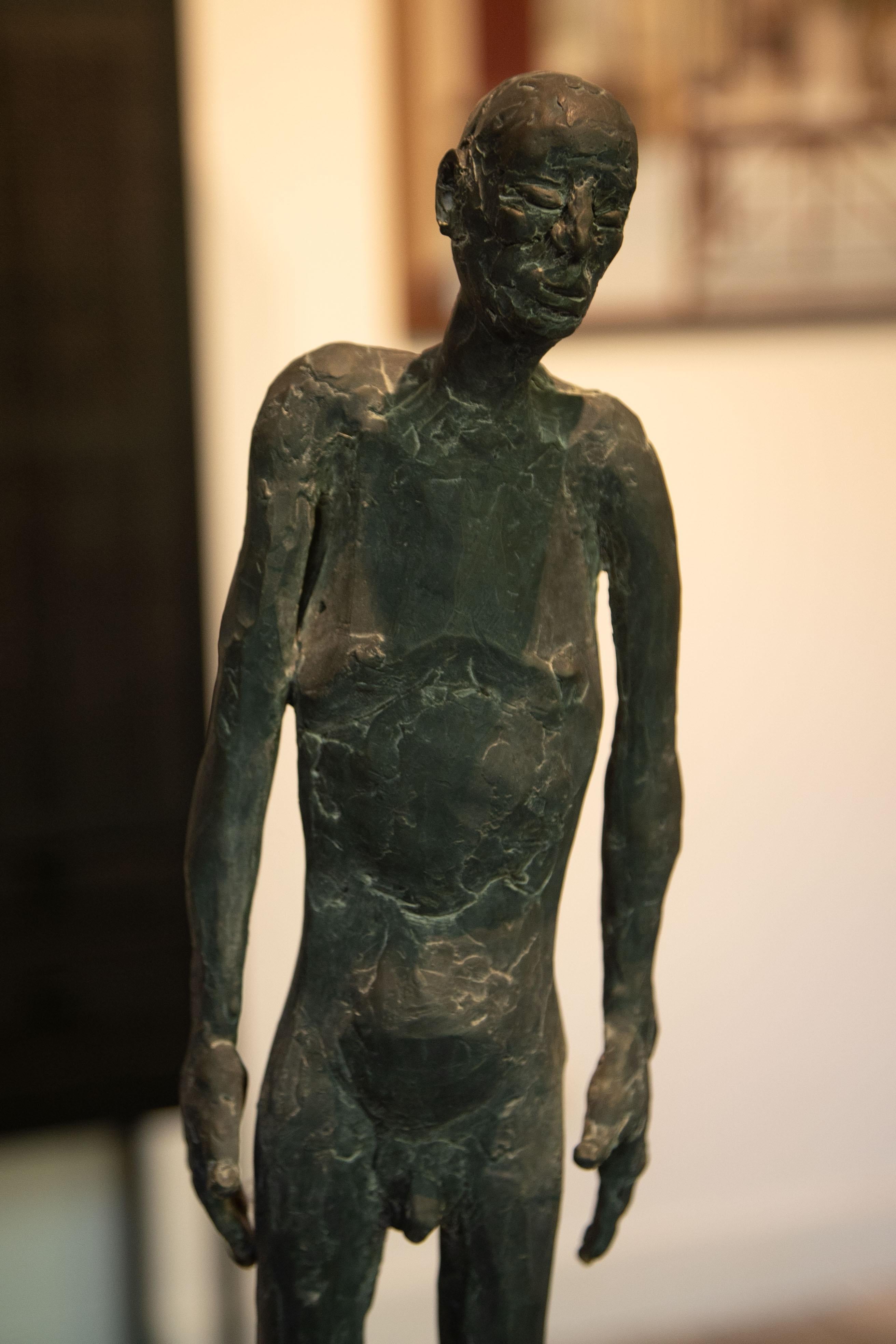 Bronze sculpture of a man standing, called 'At that time' - Sculpture by Nadine De Meester