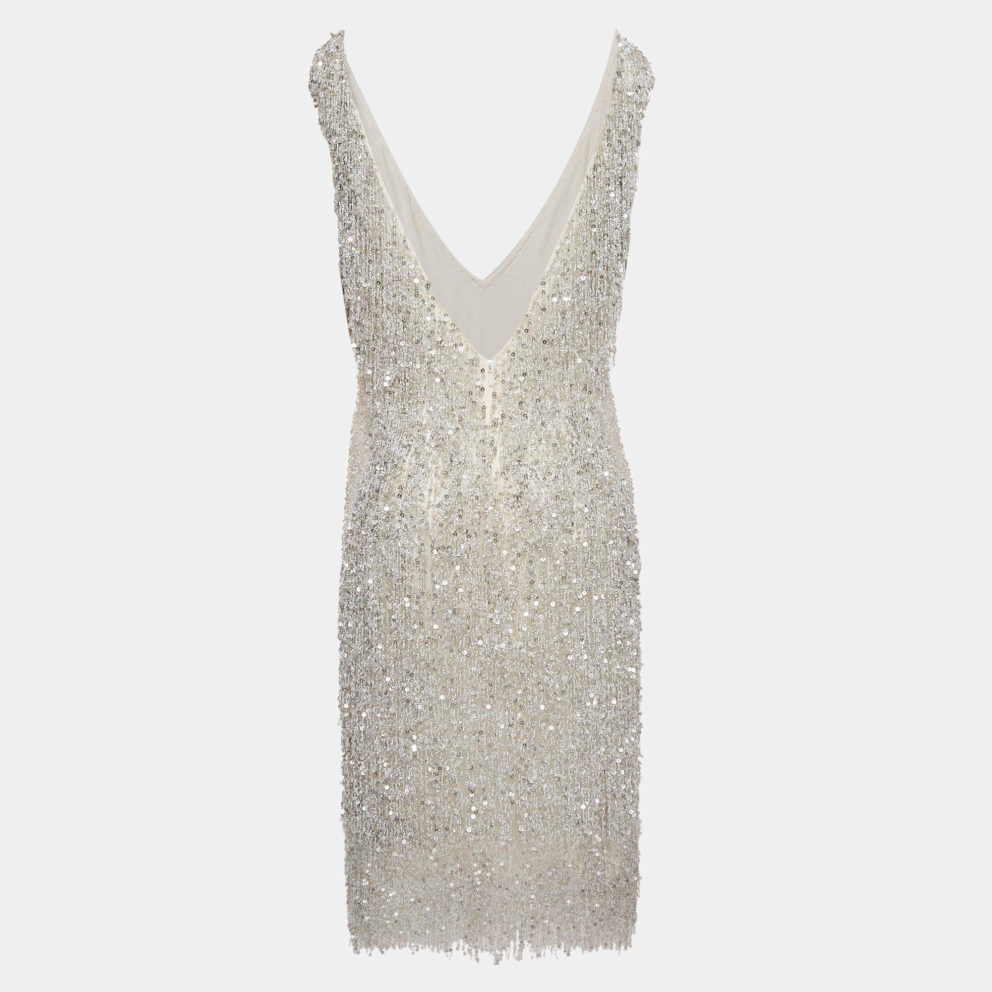 Step into timeless glamor with this Naeem Khan dress. Meticulously crafted  it embodies grace and sophistication  making it the perfect choice for those seeking an exquisite wardrobe addition.
