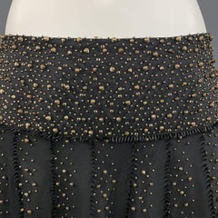 NAEEM KHAN Jupe trapèze en soie perlée métallique noire et dorée, taille 6