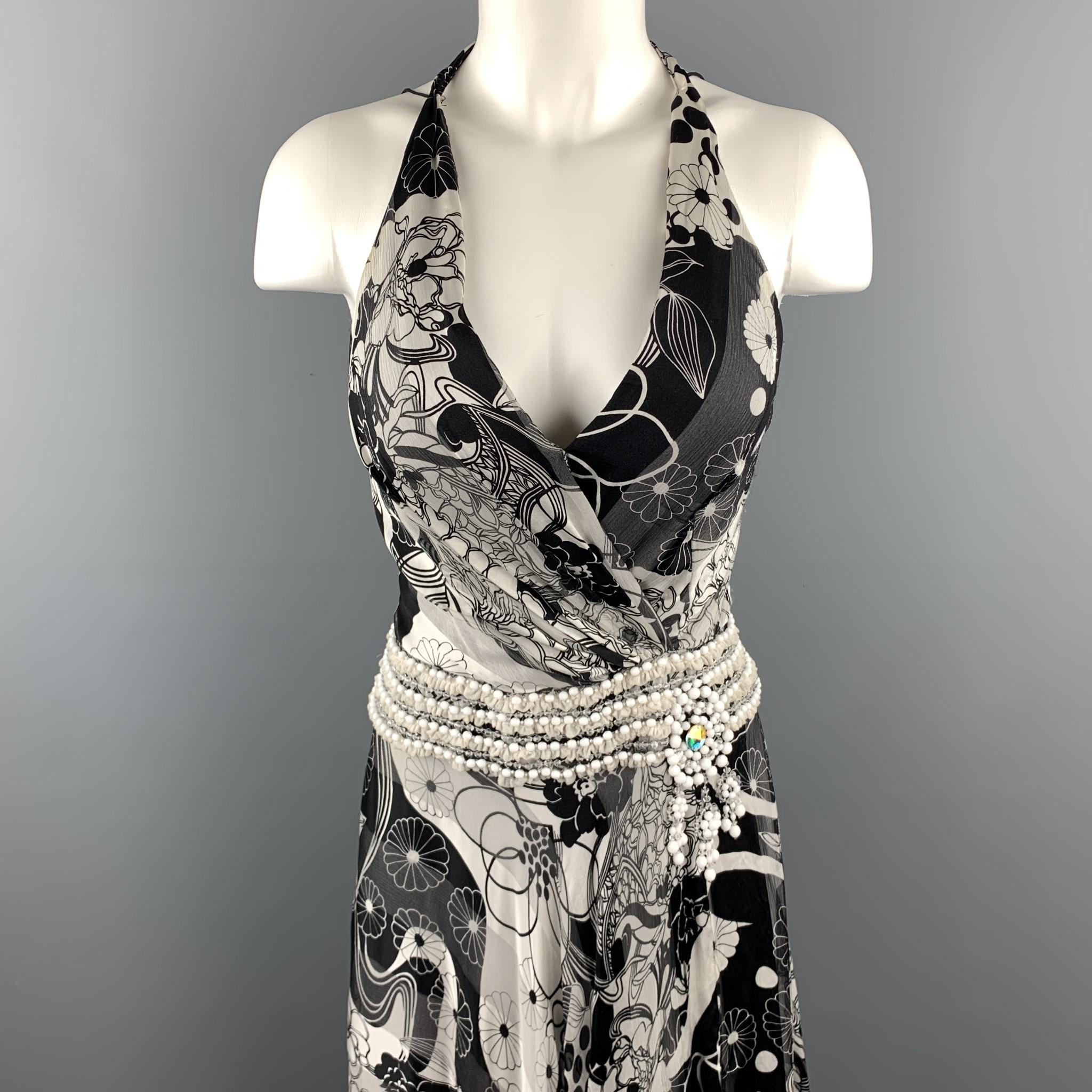 NAEEM KHAN gown comes in black and white floral print silk crepe textured chiffon with a tied halter top, side slit, and beaded trim waistline. Wear around ar holes. As-is. 

Good Pre-Owned Condition.
Marked: (no size)

Measurements:

Bust: 32
