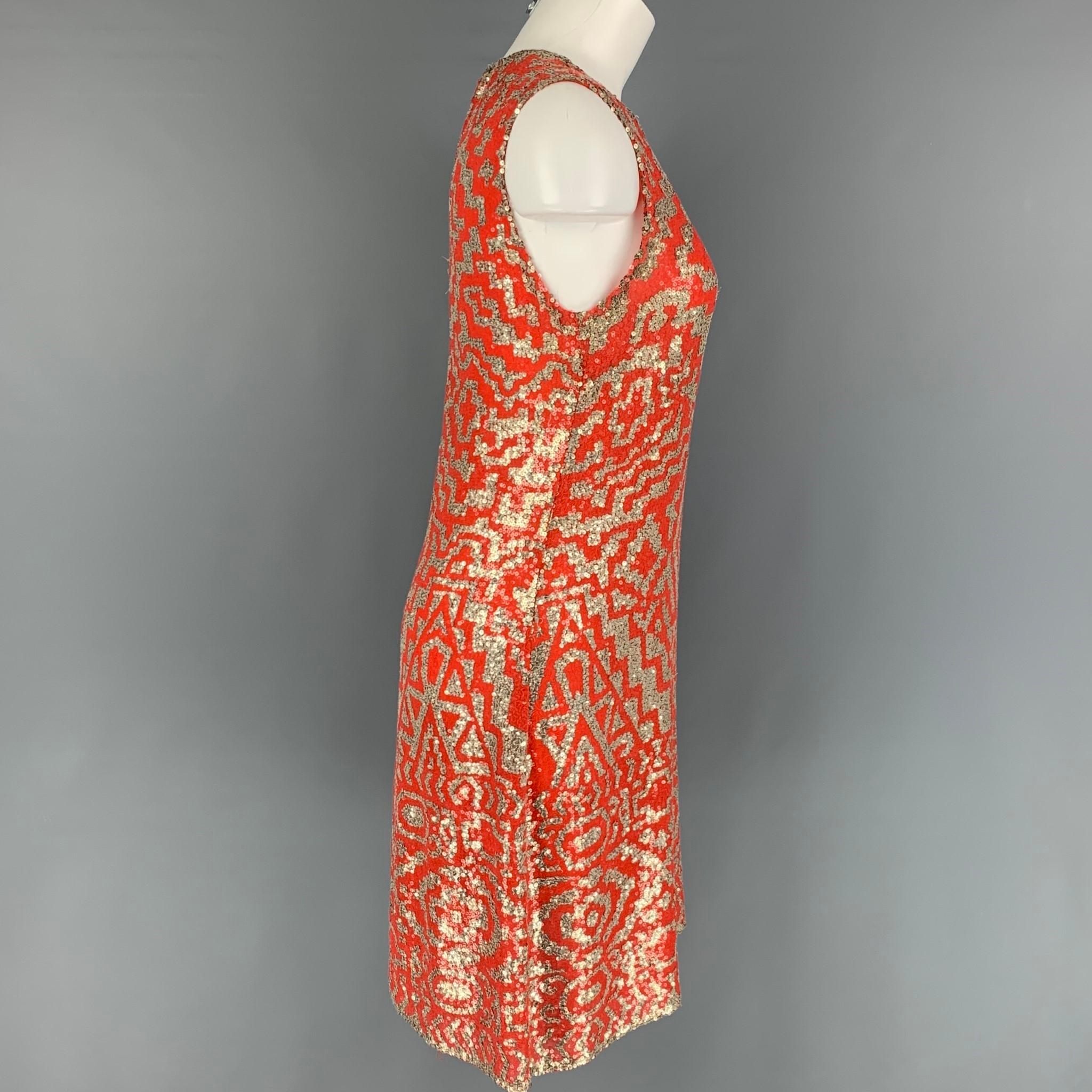 NAEEM KHAN cocktail dress comes in a orange & silver geometric sequin material featuring a sleeveless style, crew-neck, and a back zip up closure.

Very Good Pre-Owned Condition. Fabric tag removed.
Marked: Size tag removed.

Measurements:

Bust: 32