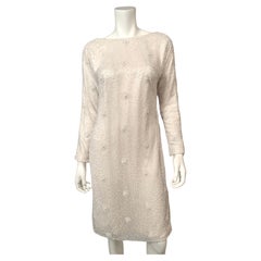 Naeem Khan, abito da sera in tulle bianco con perline e schiena drappeggiata
