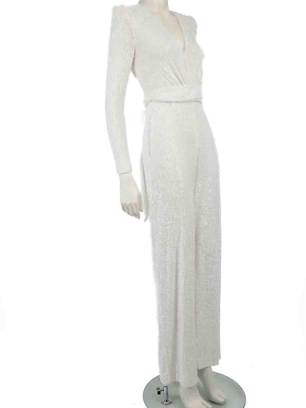 CONDITION is Very good. Hardly any visible wear to jumpsuit is evident on this used Naeem Khan designer resale item.
 
 
 
 Details
 
 
 White
 
 Synthetic
 
 Jumpsuit
 
 Sequinned
 
 Long sleeves
 
 Shoulder pads
 
 V-neck
 
 Waist tie belt
 
 Back
