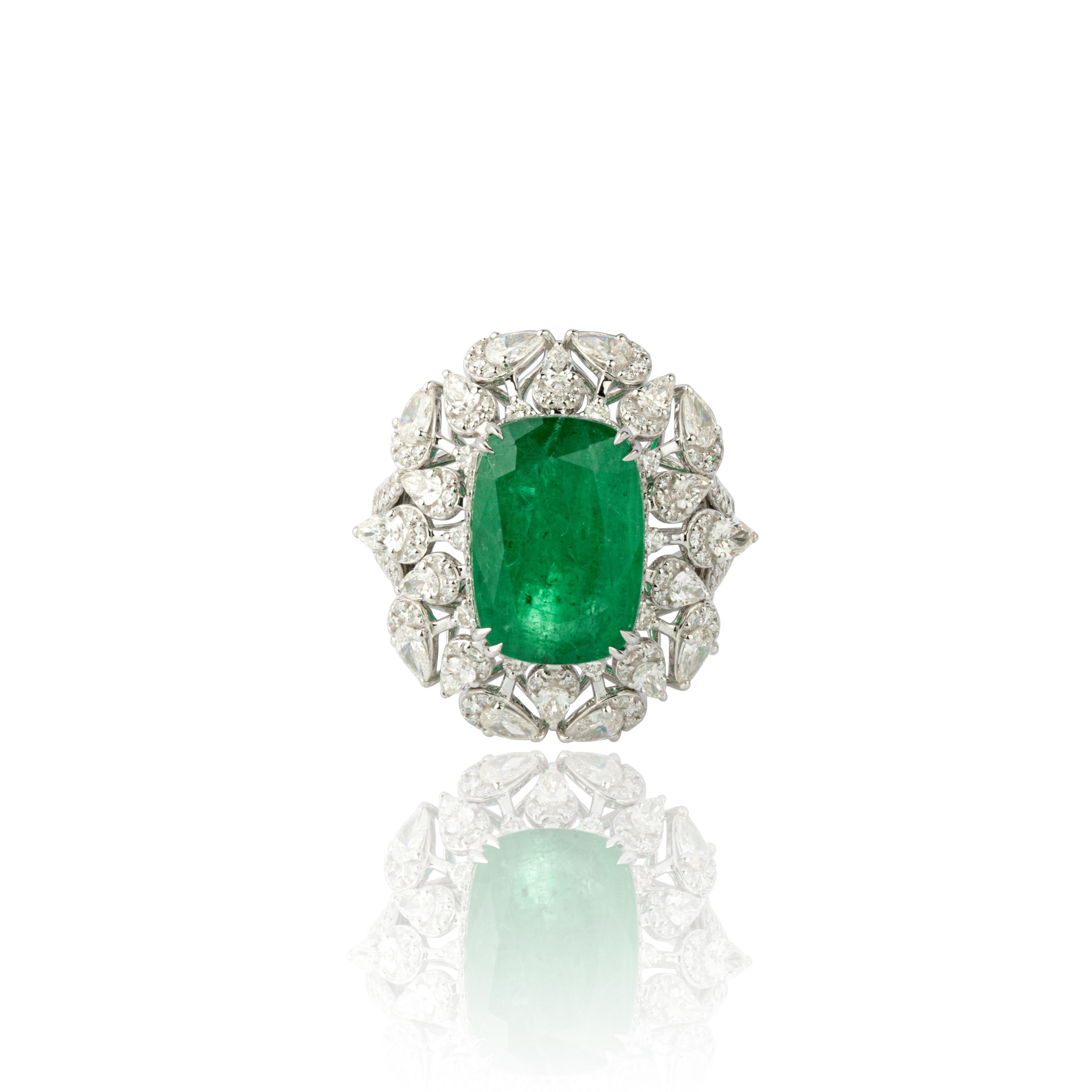 Diamonds : 1.86 carats
Emeralds : 6.16 carats
Gold : 7.49  gms
Introducing our exquisite 18 Karat White Gold Ring featuring a stunning 6.16 carat natural Zambian Emerald and 1.86 carats of diamonds. This ring is truly remarkable, showcasing the