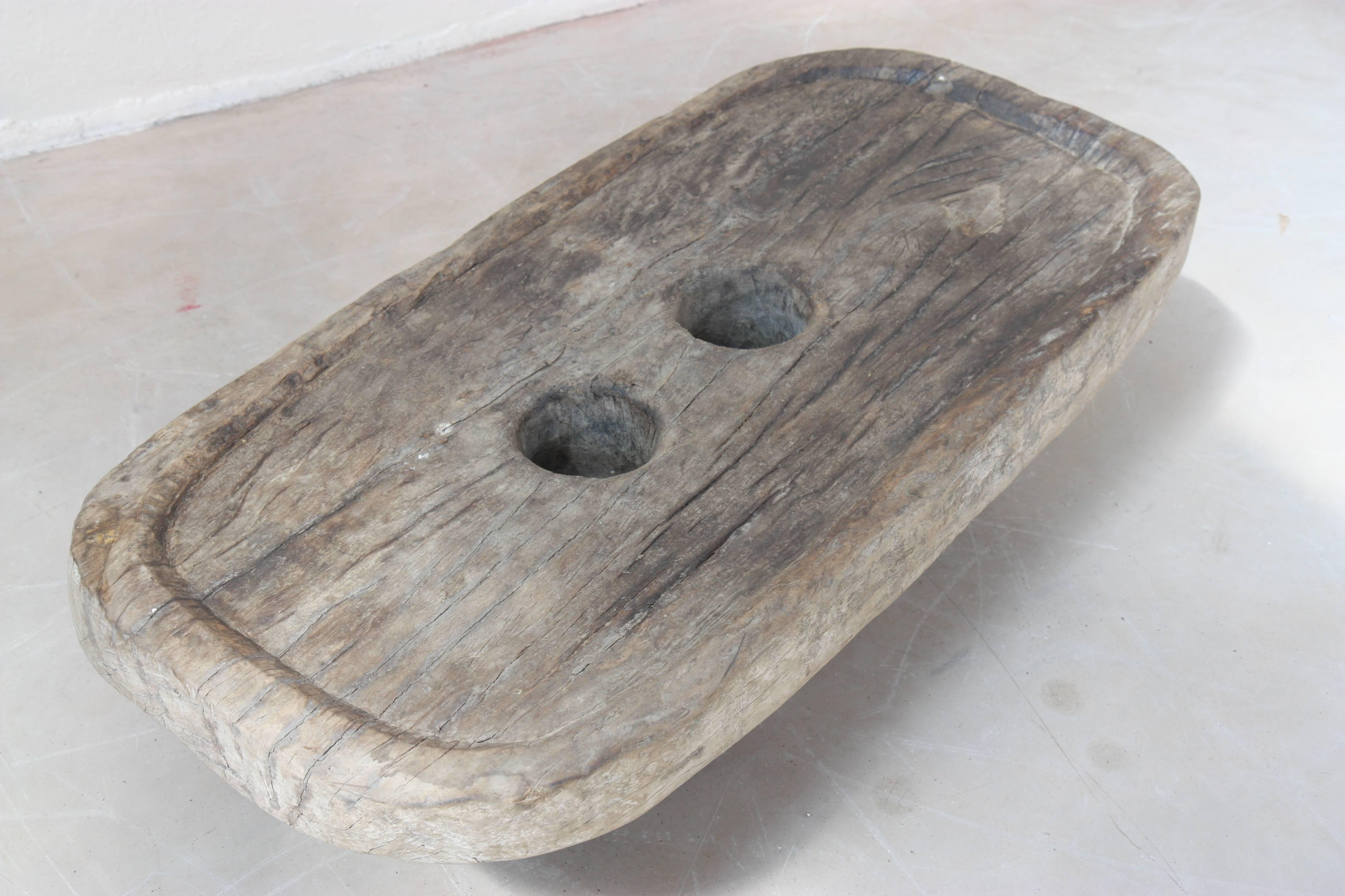 In oval shape teak with two holes on the tray.
Provenance: North East India.