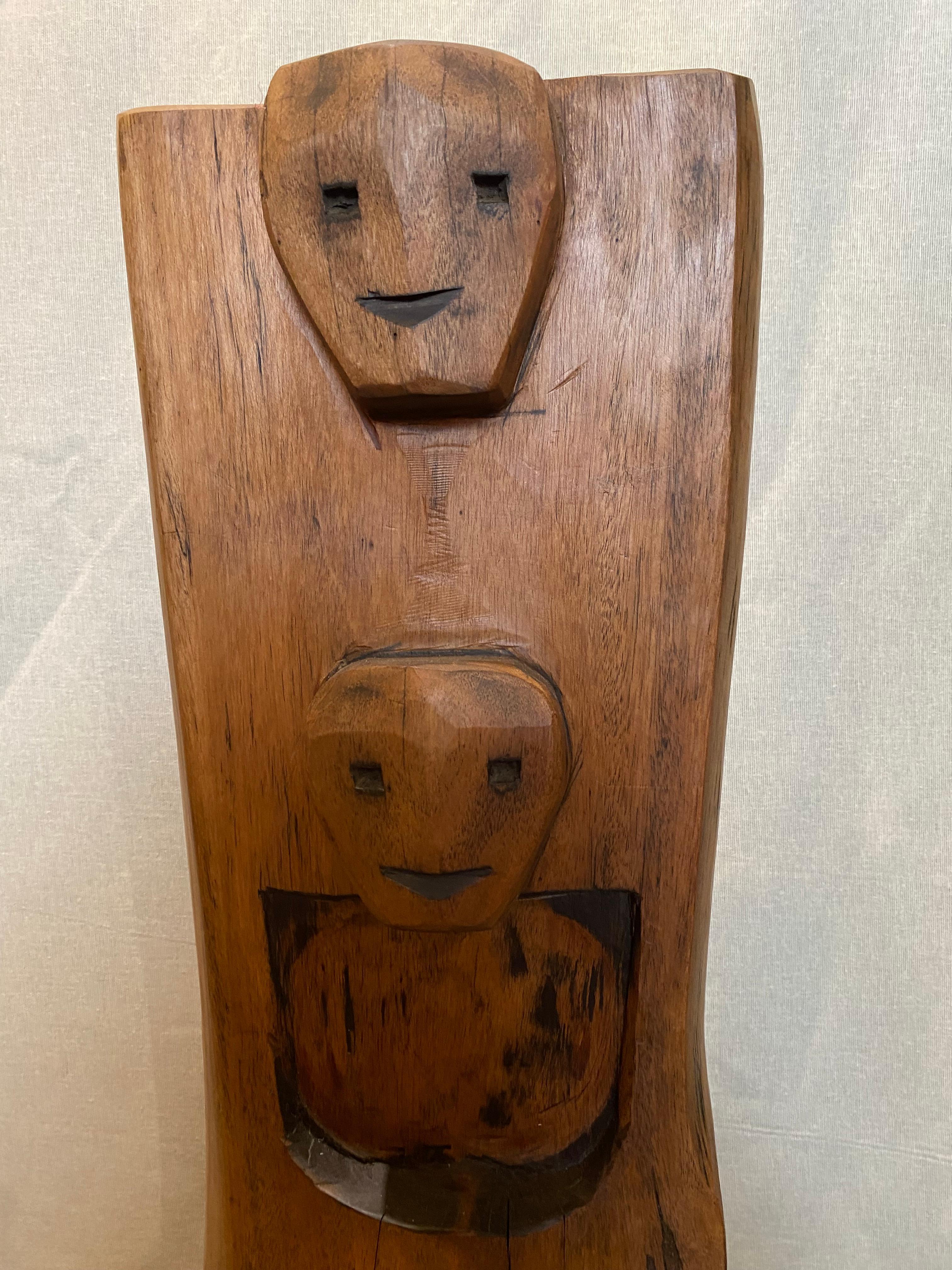 totem panel from Nagaland.
the Naga people lives on the Indo-Burmese border. head-cutter people they make their own furniture by digging tree trunks giving a refined and brutalist style
the foot has been added but can be removed for hanging on the