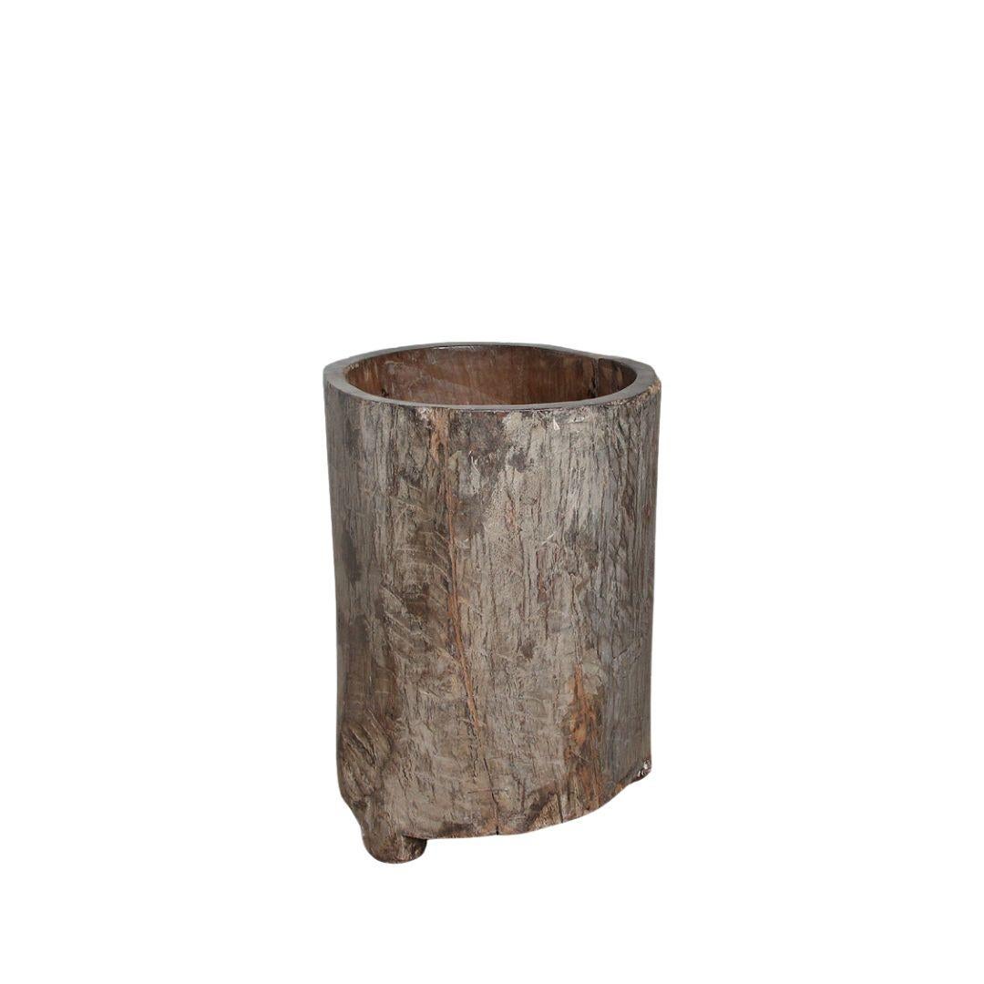 Sculptural and functional, this rare wooden vessel hails from the remote highlands of Nagaland, a culturally rich region in northeastern India. Carved from a single trunk of what is likely Saal wood, the piece exemplifies the Naga people's