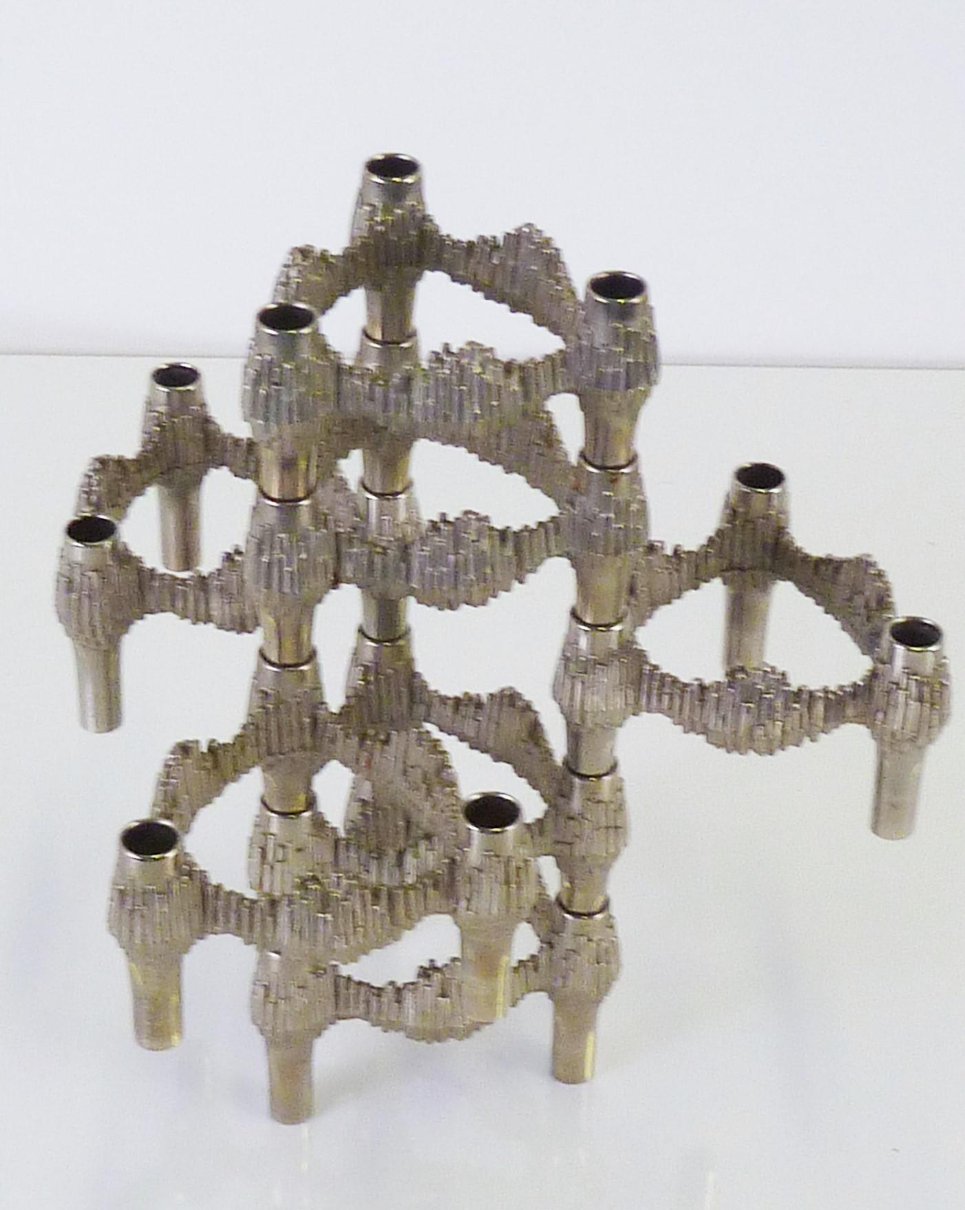 Set of 7 Quist Variomaster stackable Brutalist candleholders designed by Caesar Stoffi for BMF Nagel, Germany 1970s. These particular candleholders are not seen as often as the more common Nagel candleholder with its smooth finish also made from