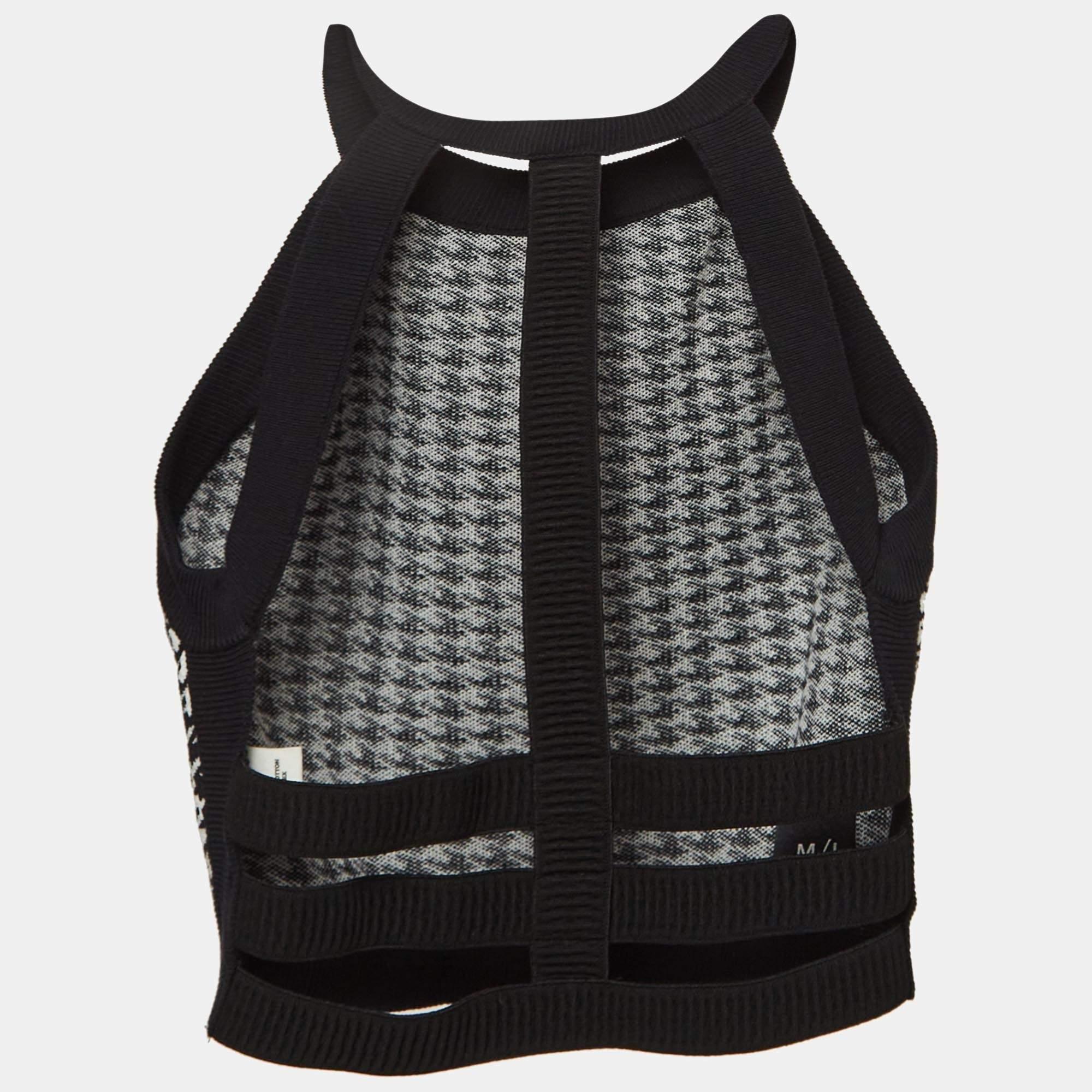 Das Nagnata Crop-Top kombiniert markantes Design mit erstklassigem Komfort. Mit auffälligem Hahnentrittmuster  Dieses Crop-Top ist aus nachhaltigen Materialien gefertigt und hat eine stützende Passform. Der offene Riemen am Rücken sorgt für einen