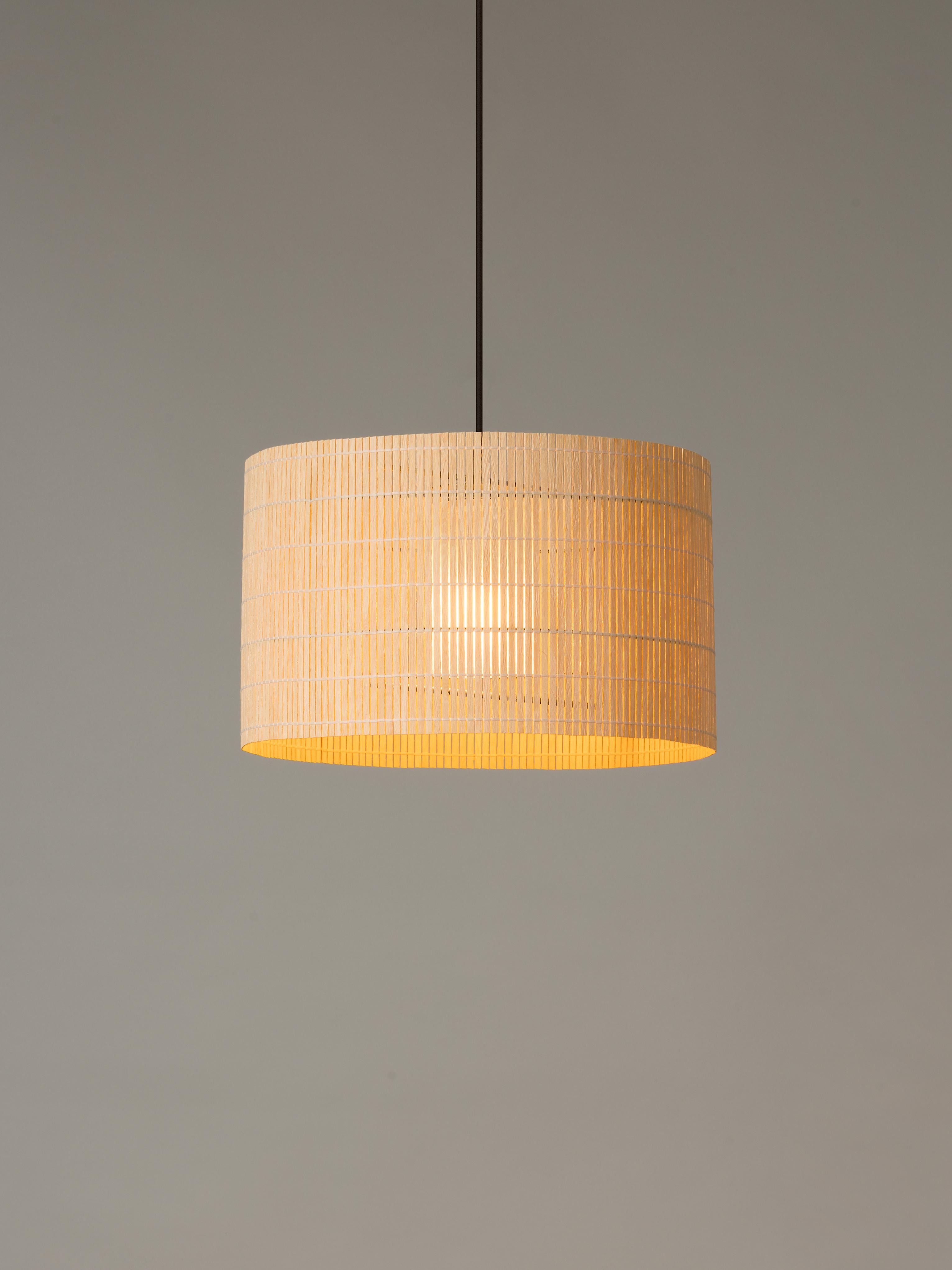 Nagoya pendant lamp by Ferran Freixa
Dimensions: D 42 x H 25 cm
Materials: Wood strips, metal.

Nagoya is made of thin vertical strips of poplar wood attached to a discreet circular structure comprising metal rods. Poplar is a beautiful, soft