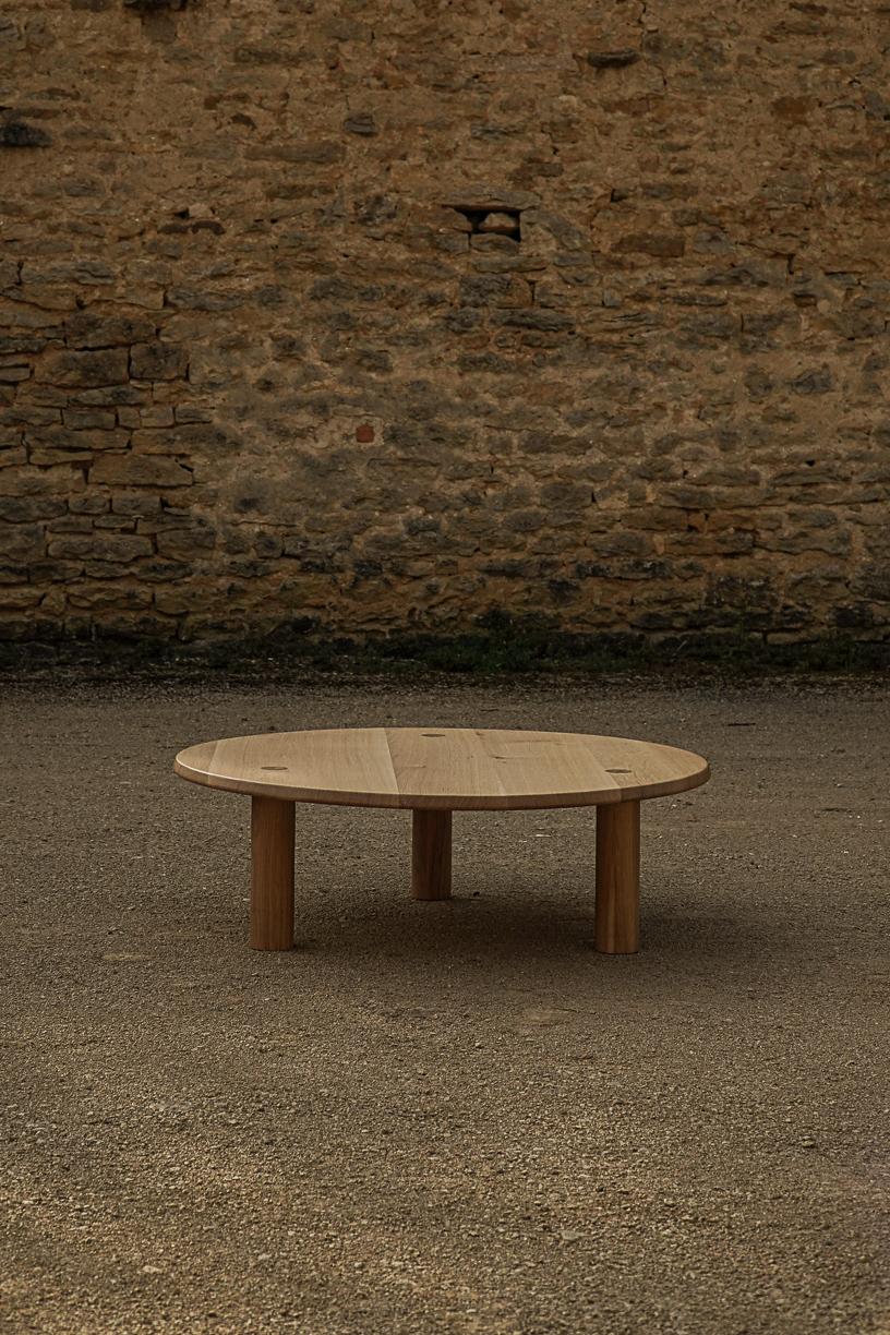 Nahele Varnished Oak Table by La Lune
Dimensions: Ø 105 x H 34 cm.
Materials: Solid oak.

Varnished solid oak. Local wood. Produced in France. Custom sizes available.  Available in oiled solid burnt. Also available in a smaller size (Ø 80 x H 30