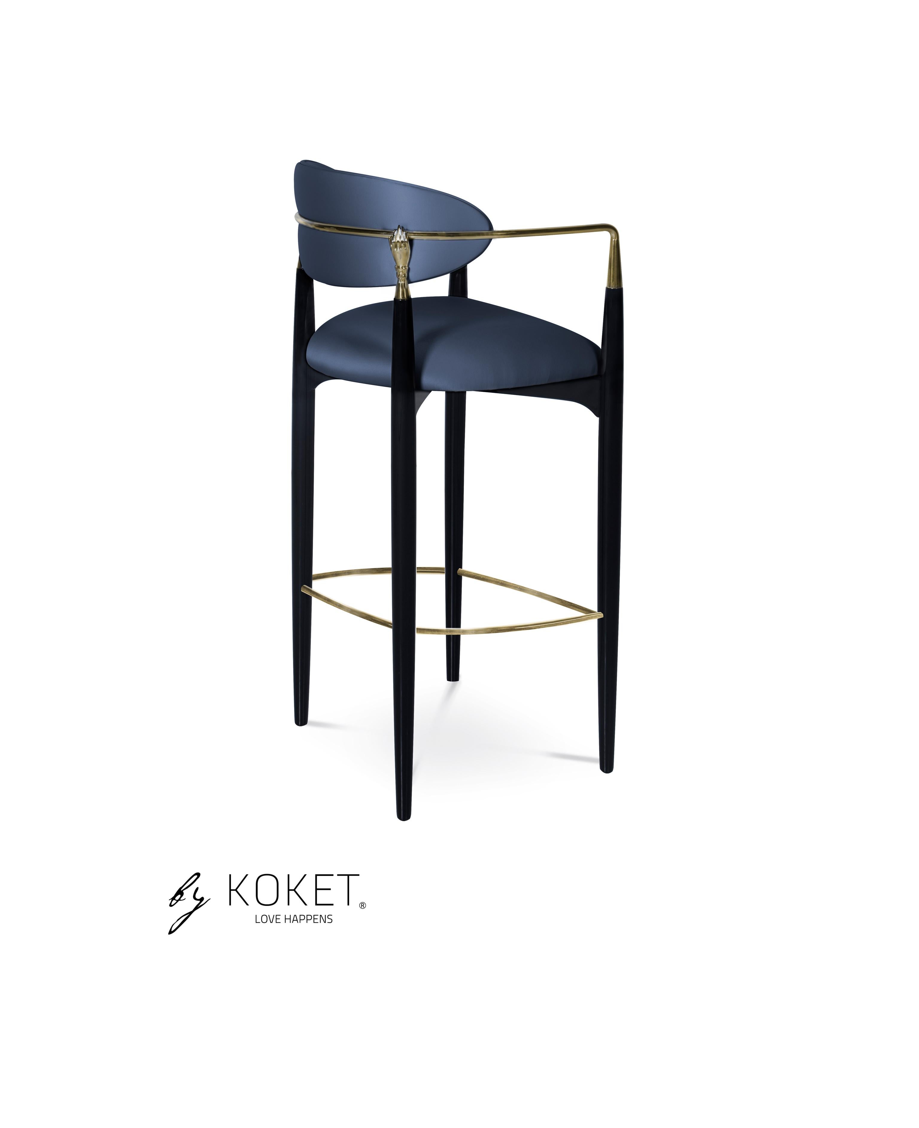 Try not to get handsy with the flirty and modern design of the Nahe´ma bar stool. Her sweet seat and contemporary detached back are bound by a metal and lacquer frame complete with two hand details, insistently grasping at your