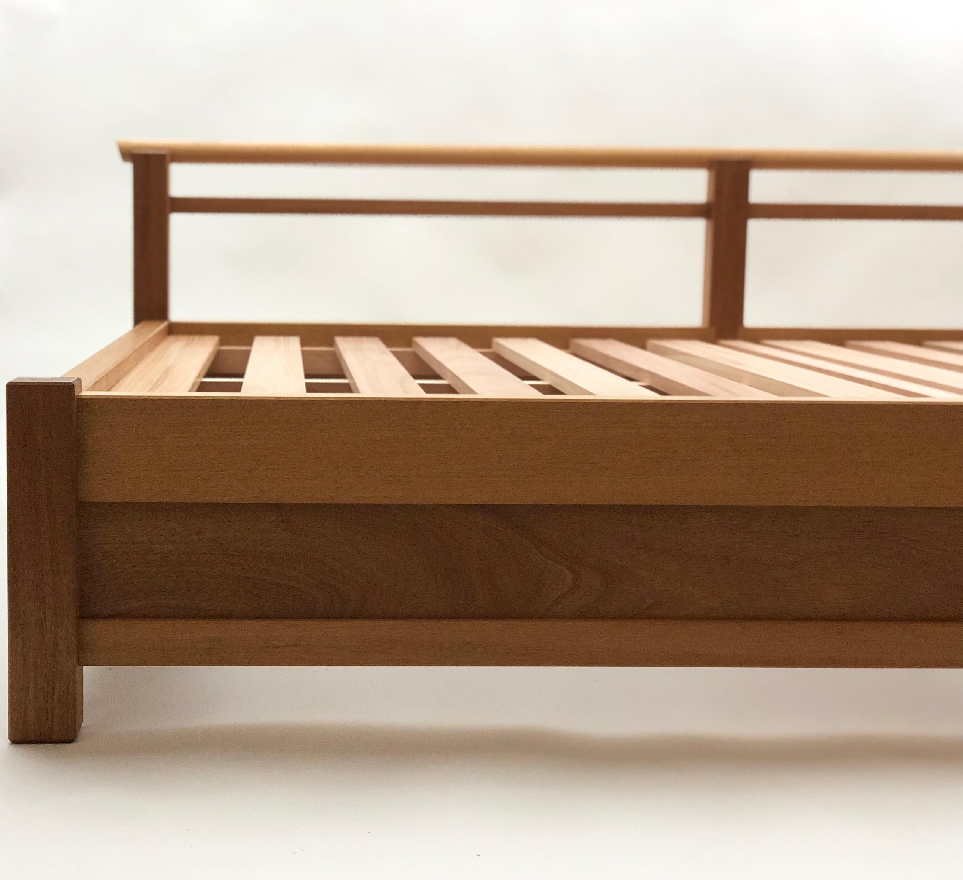 This daybed was inspired by the Uji bridge at Naiku temple in Japan. It is featured in Honduran mahogany and made for indoor/outdoor use in Honduran mahogany. This daybed is also available in oiled walnut or oiled ash. 

The construction of this