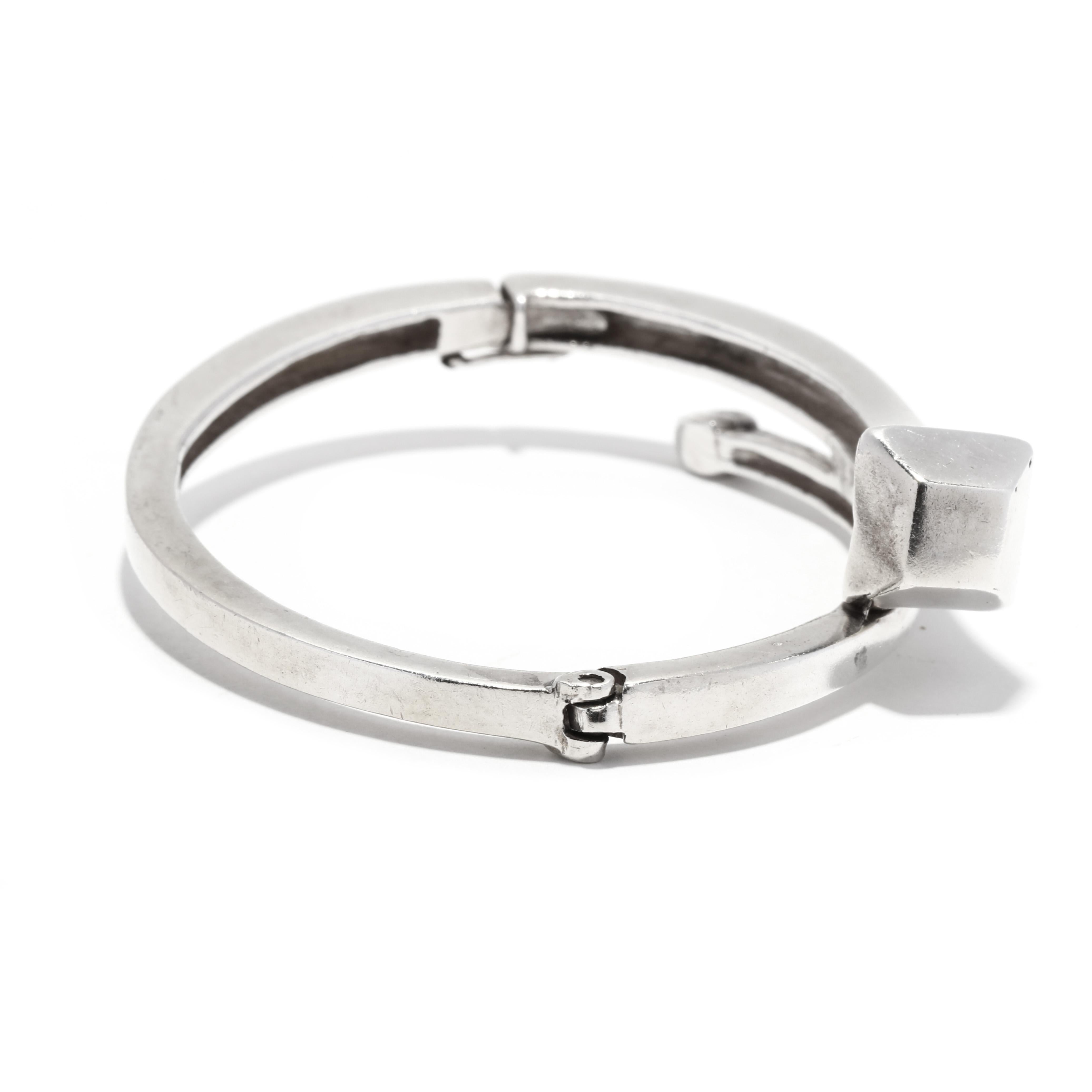 This minimalist nail shaped crossover bangle bracelet is a perfect accessory to elevate any look! Crafted in sterling silver, this bracelet measures 6.25 inches and is the perfect piece for everyday wear. Its unique crossover shape gives it an
