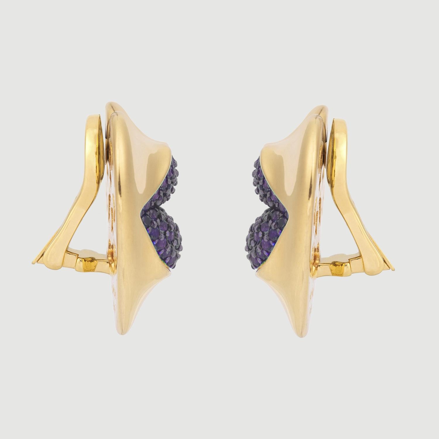 Love starts with the heart and lasts on the lips. These might be the sexiest earrings ever! Our sexy gold statement heart earrings with amethyst kisses. Shine your love on!

Composition: Sterling Silver, 18k gold vermeil and Rhodium plated.
Color: