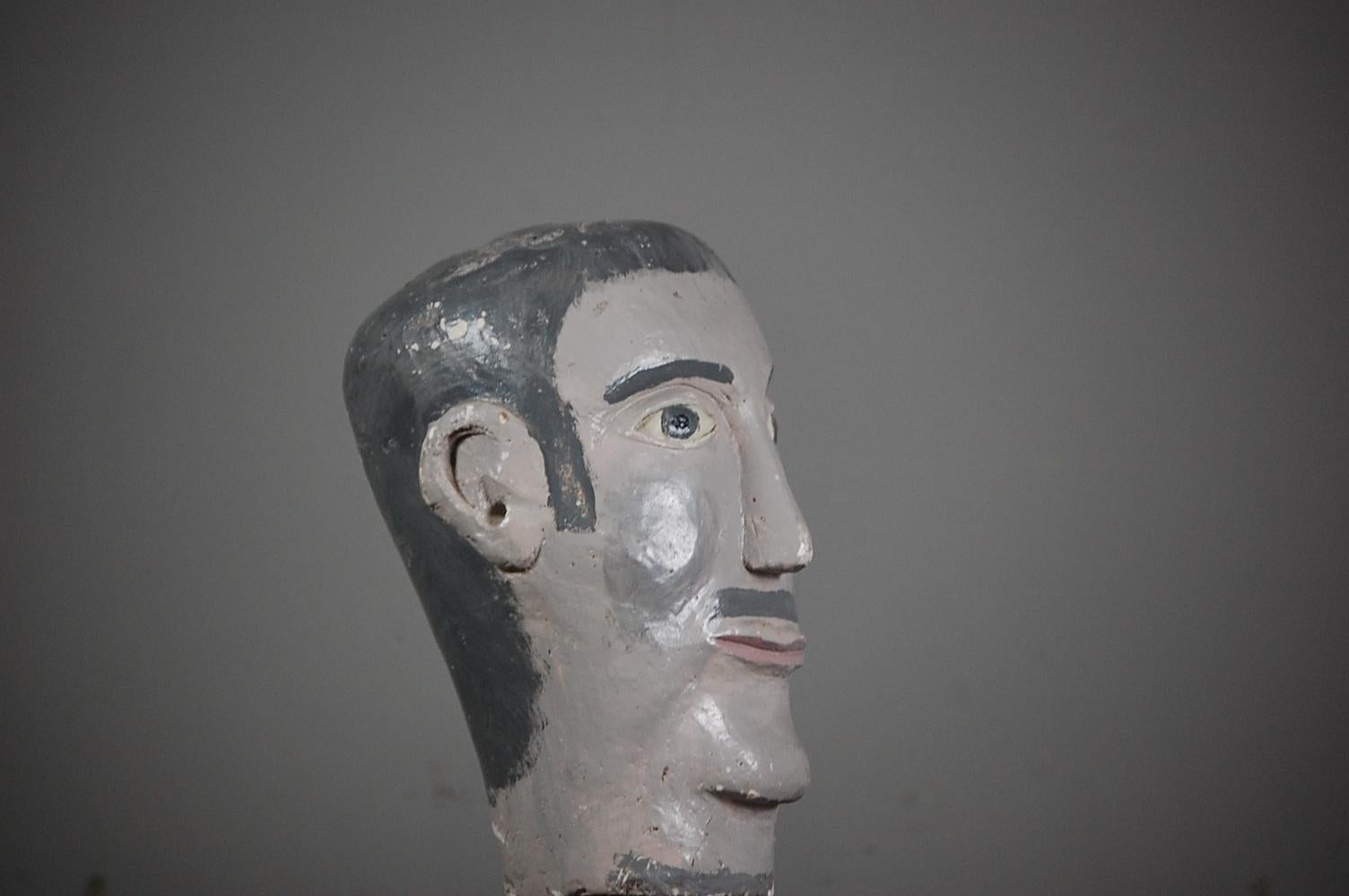 Naive plaster painted mannequin head, cheery and expressive. Probably used as a model for a hat or wig display in a retail setting, France, circa 1950.