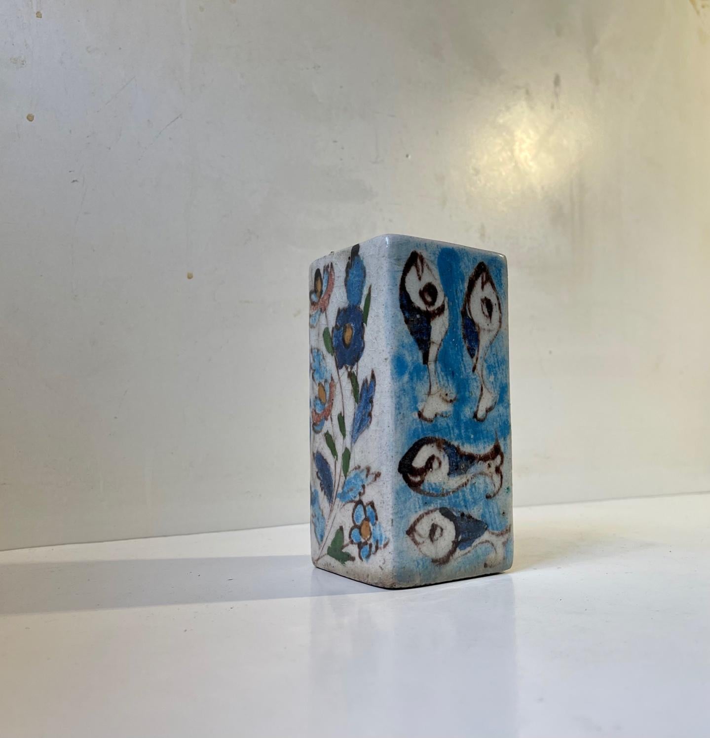 Rectangular handprinted stoneware vase with 4 motifs: 2 with fishes and two with flowers. It has no markings but we suspect it was made by Italian ceramist Guido Gambone during the 1940s or early 50s. That being said it is sold as in the manner of