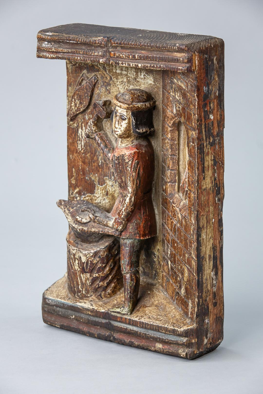 Relief carved blacksmith in his workshop, original paint, deep relief carving. Most likely Austrian, circa 1900.
Dimensions: 24cm x 36cm x 8cm.