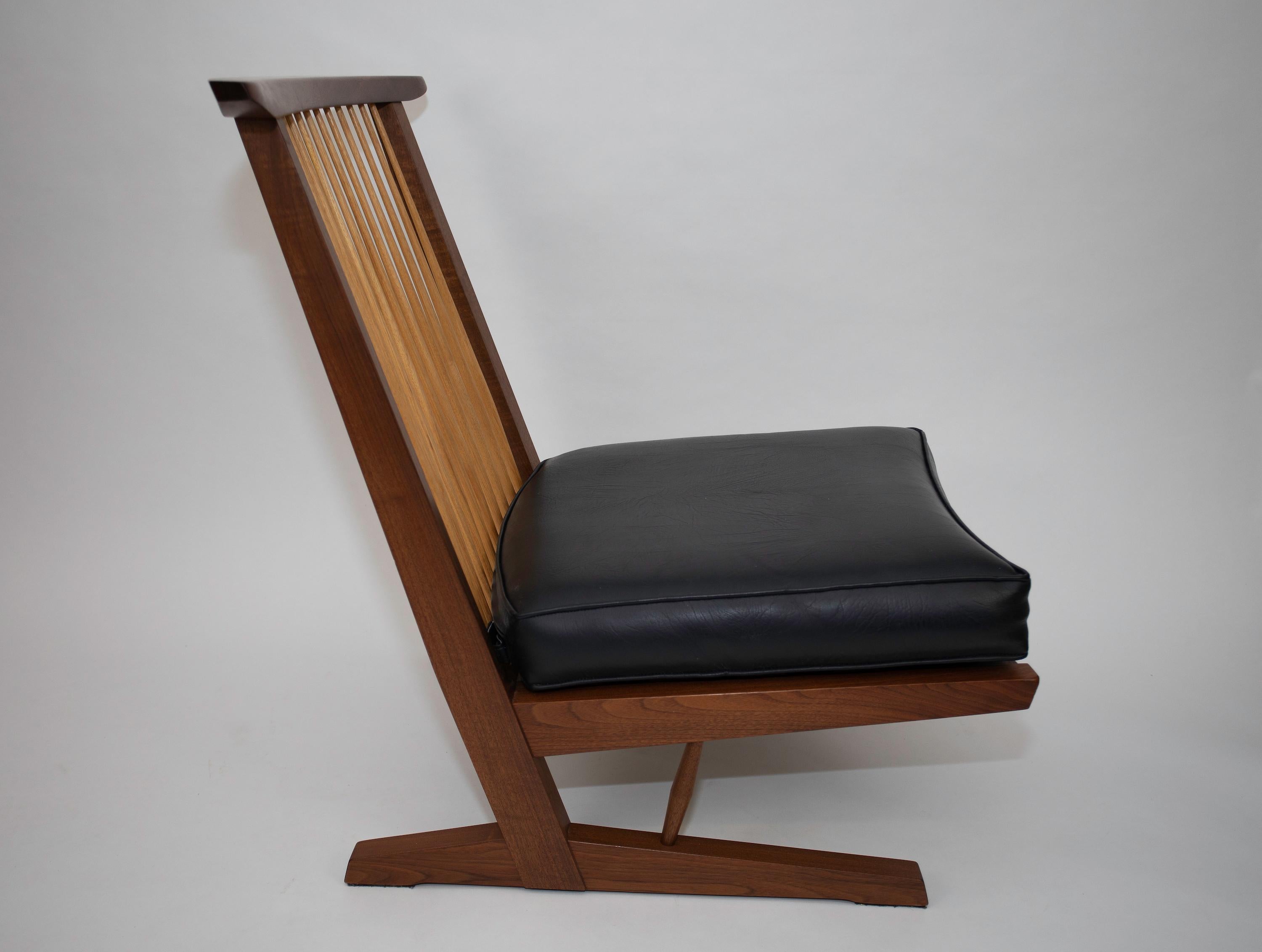The classic lounge chair from Nakashima Studios.
Original surface and cushions.
Signed and dated September 26 ,2000.