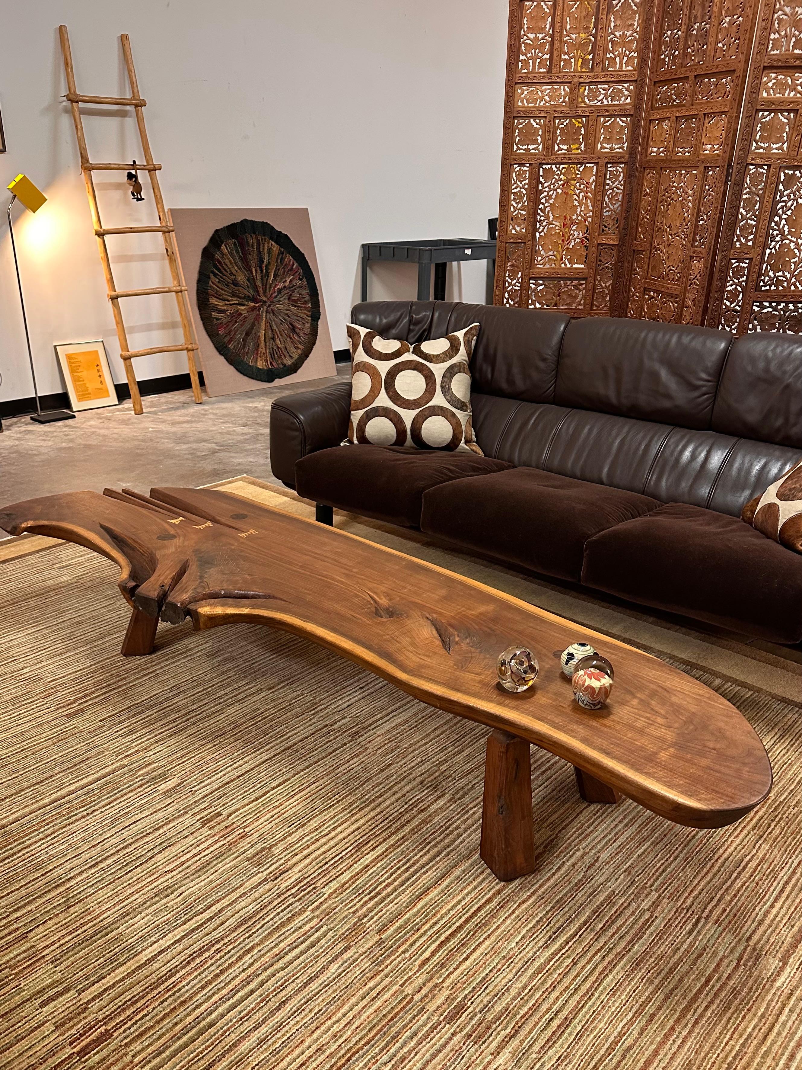 Nakashima Style Live Edge Walnut Slab Coffee Table

This free-form, live edge coffee table was hand-carved by an unknown craftsman from a substantial slab of black walnut. This slab of wood has some gorgeous grain! Oak butterfly keys are inlaid at