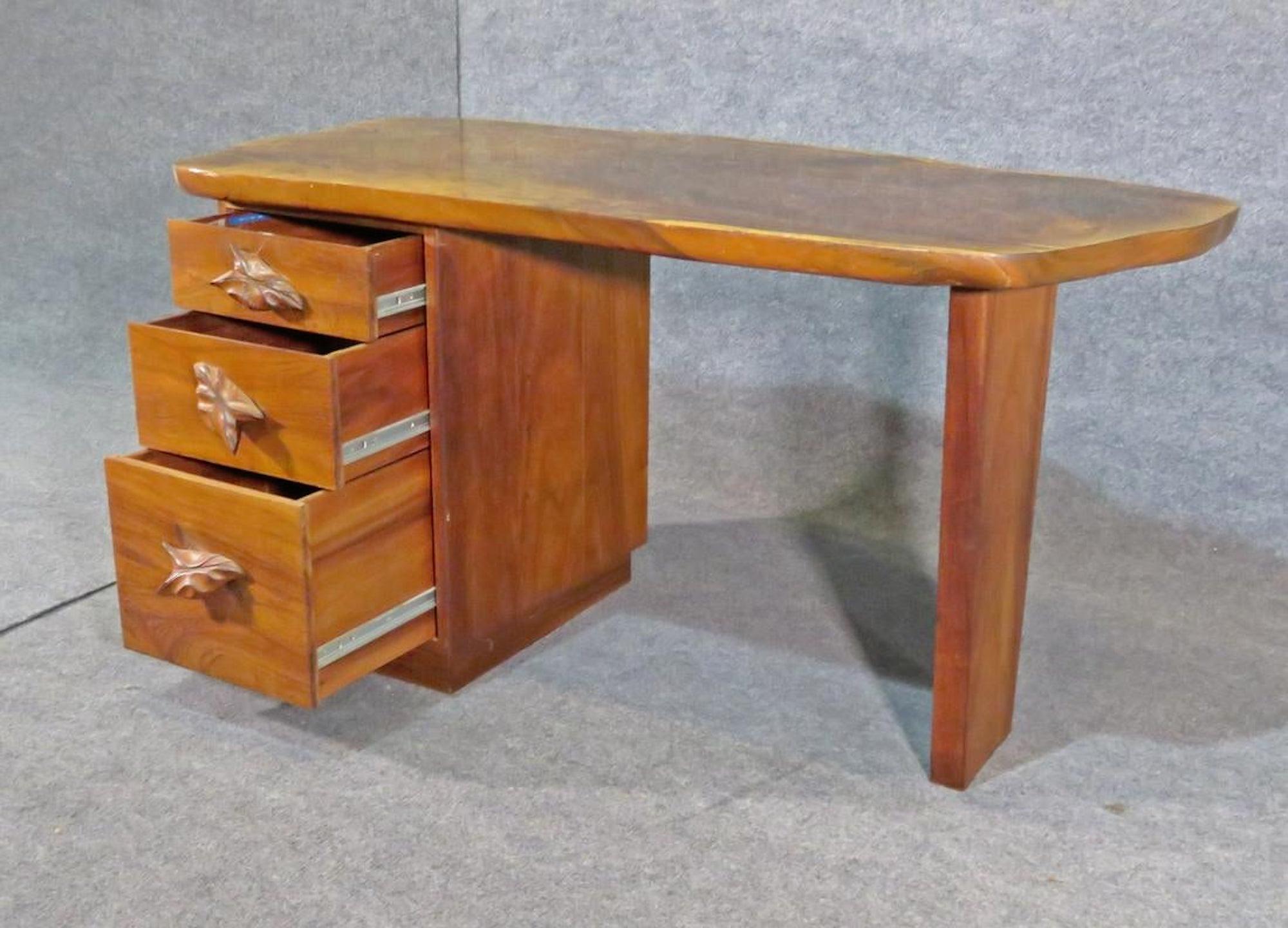 Mid-Century Modern style desk with decorative leaf handles and large tree slab top.
(Please confirm item location - NY or NJ - with dealer).
 