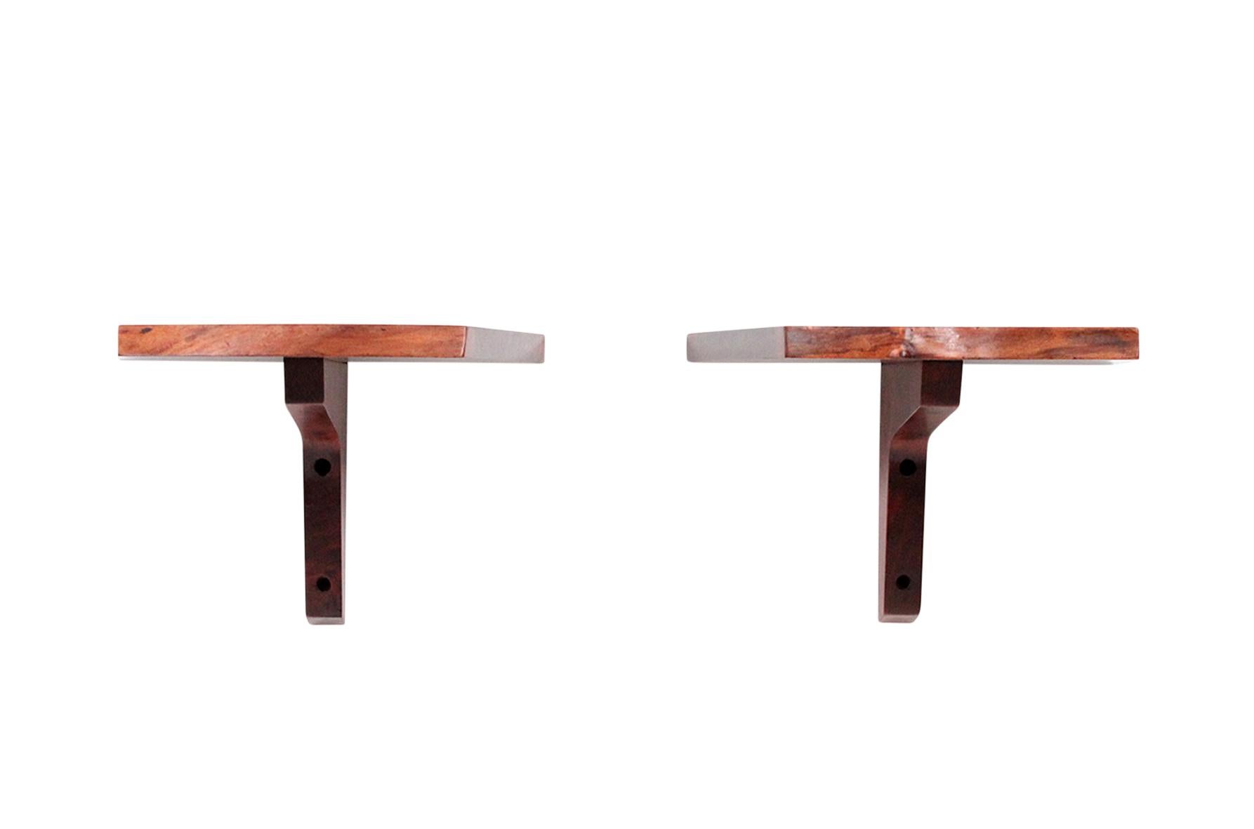 Pair of petite George Nakashima wall mounted shelves in walnut and with free-edges, circa 1975.